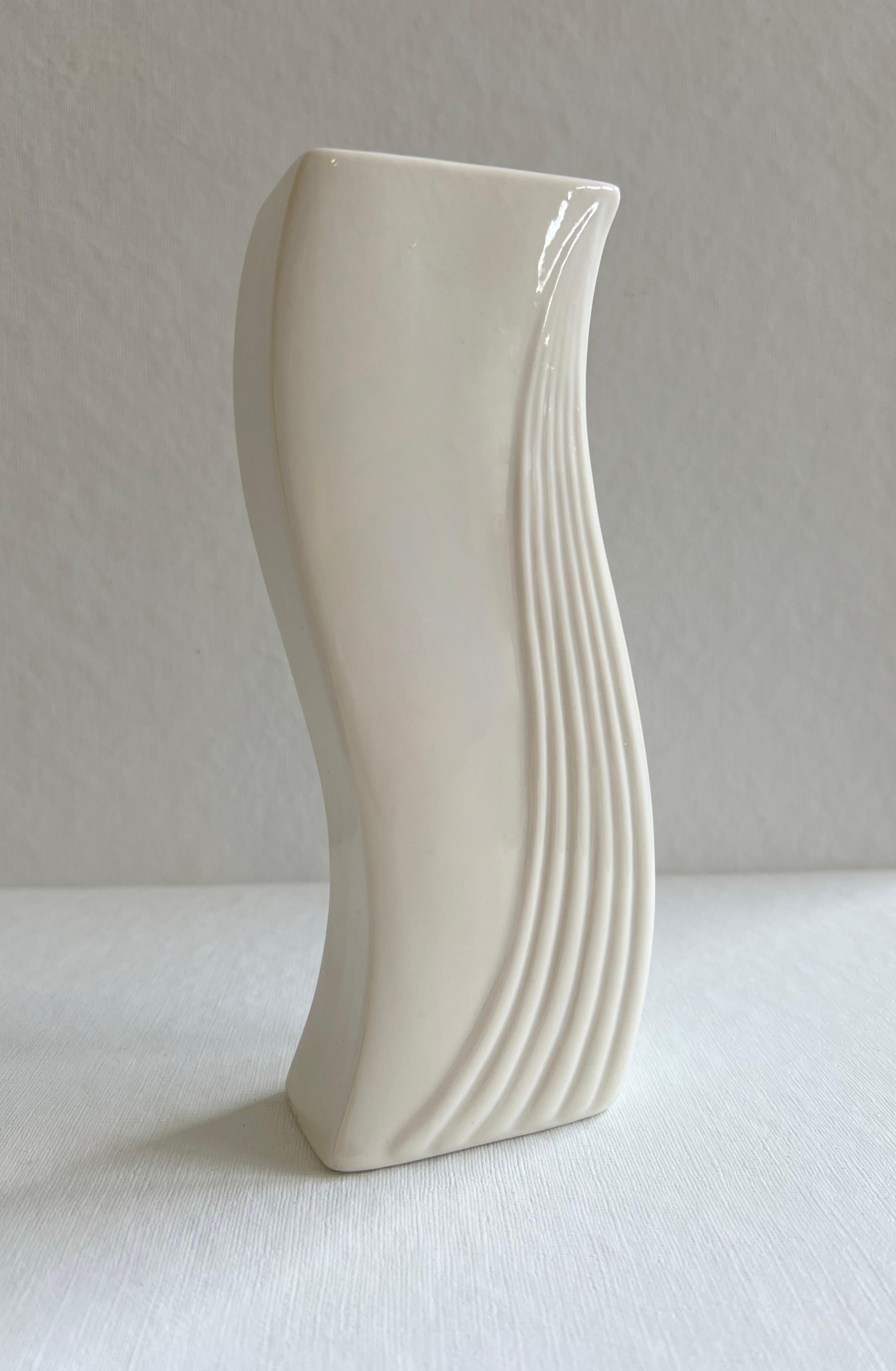 Beautiful art deco-style candlestick candleholder by Belleek Pottery Ltd., Ireland. Lovely lines on this cream porcelain candle holder.  Delicate, simple, and elegant all at the same time. Makers mark on the bottom.