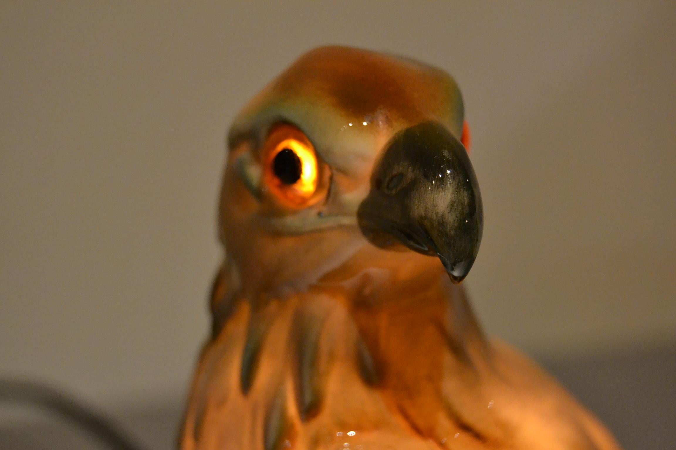 Impressive porcelain perfume lamp of an eagle with glass eyes.
This animal statue, animal light, bird lamp dates from the Art Deco period where great colors were used.
This table lamp dates circa 1930-1940, was made in Germany and wears number 8420