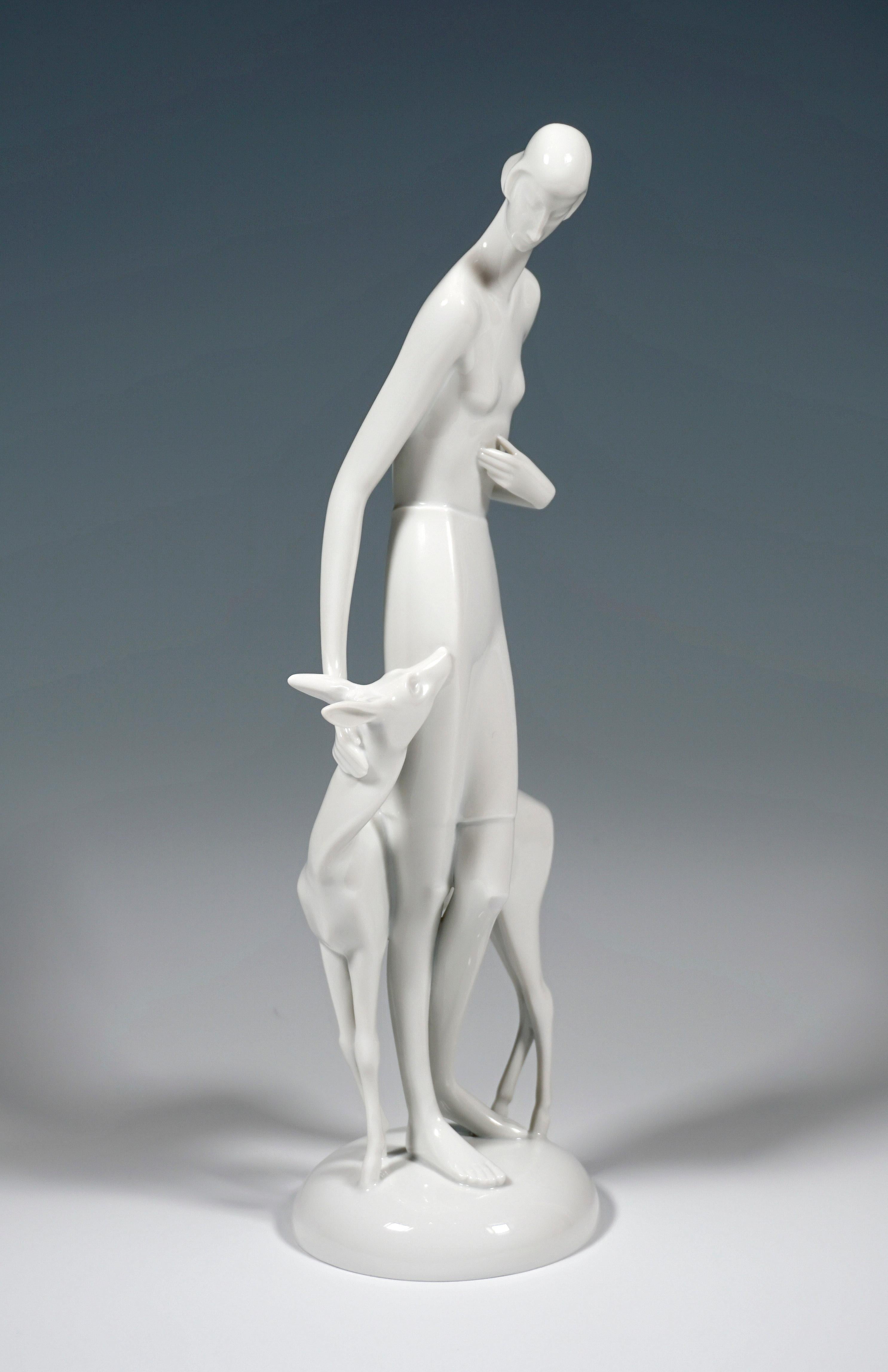 Manneristly elongated young woman, stroking a deer, clad only in a knee-length skirt.
On a cambered, round base.

Designed by Gerhard Schliepstein (1886 - 1963), German sculptor and designer of Art Deco as well as a porcelain modeller. Until the