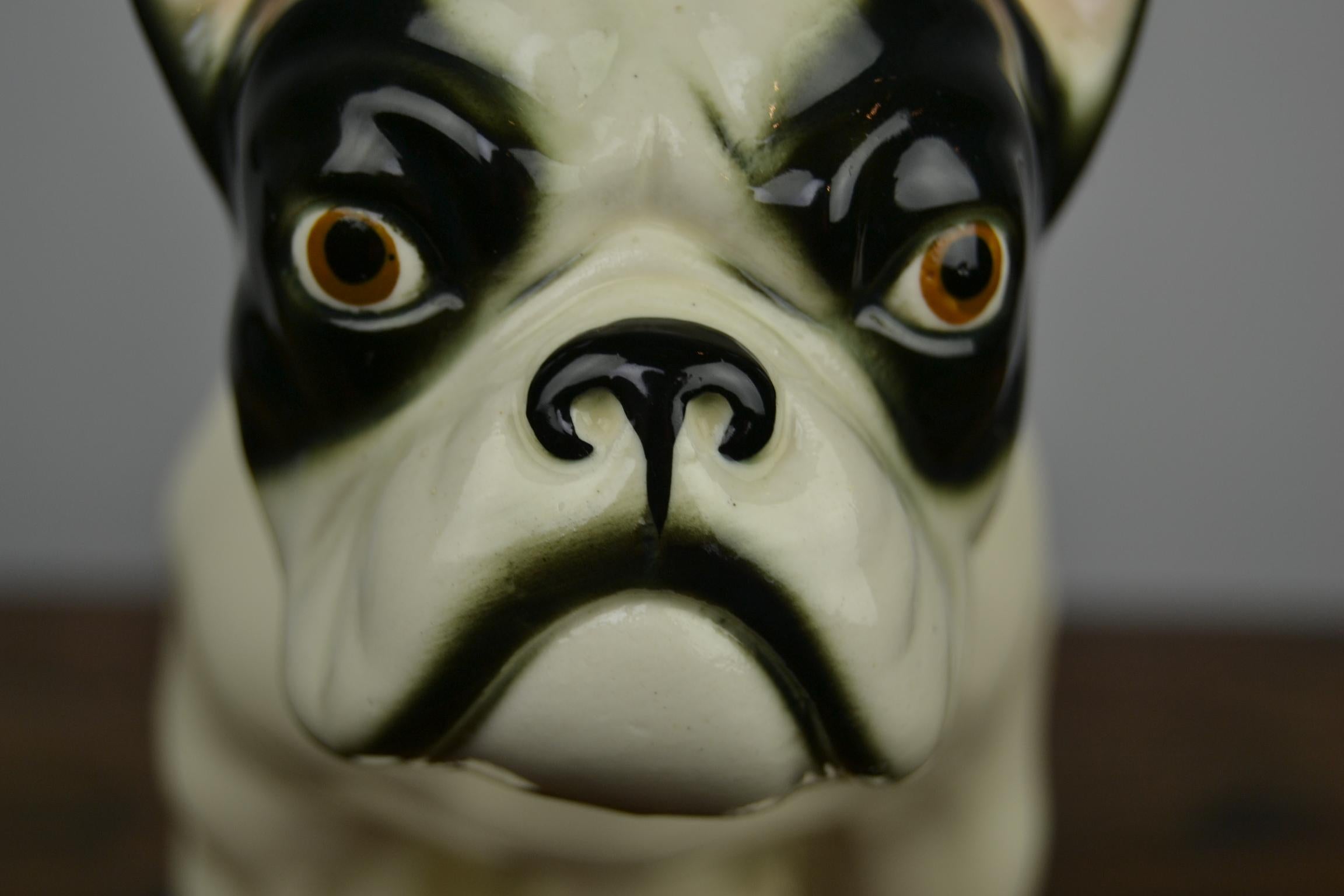 Large sized porcelain French bulldog figurine. 
This black and white French bulldog - Bullie dates from the Art Deco Period, 1930s , 
and was made in Germany. It's a numbered statue with an unknown maker. 

This animal statue is not perfect.