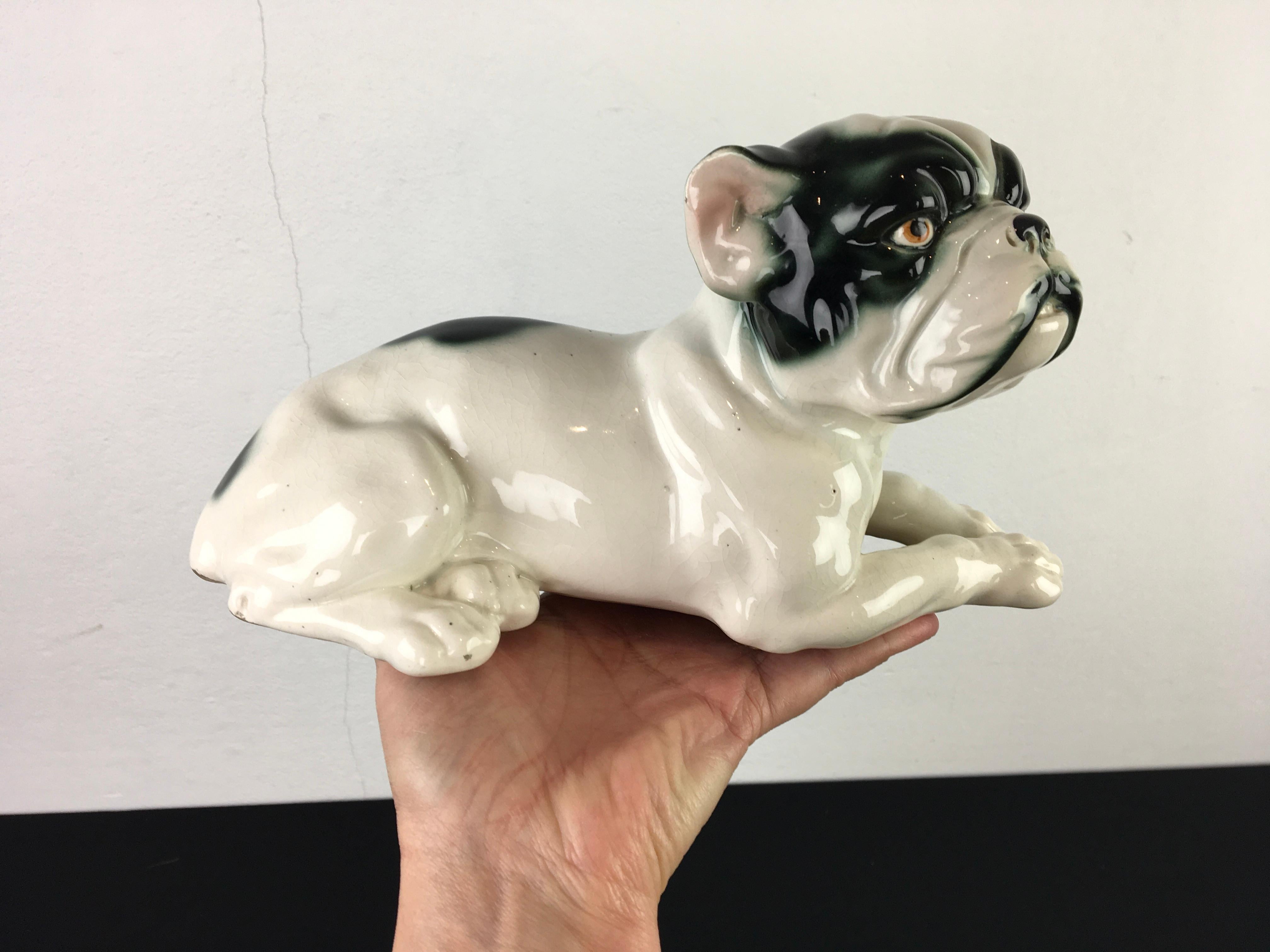 Large porcelain French bulldog sculpture from the Art Deco period.
This black and white French bulldog - Frenchie or Bullie dates from the 1930s and was made in Germany. It's a numbered statue - 8853 - with an unknown maker. 

A great animal statue