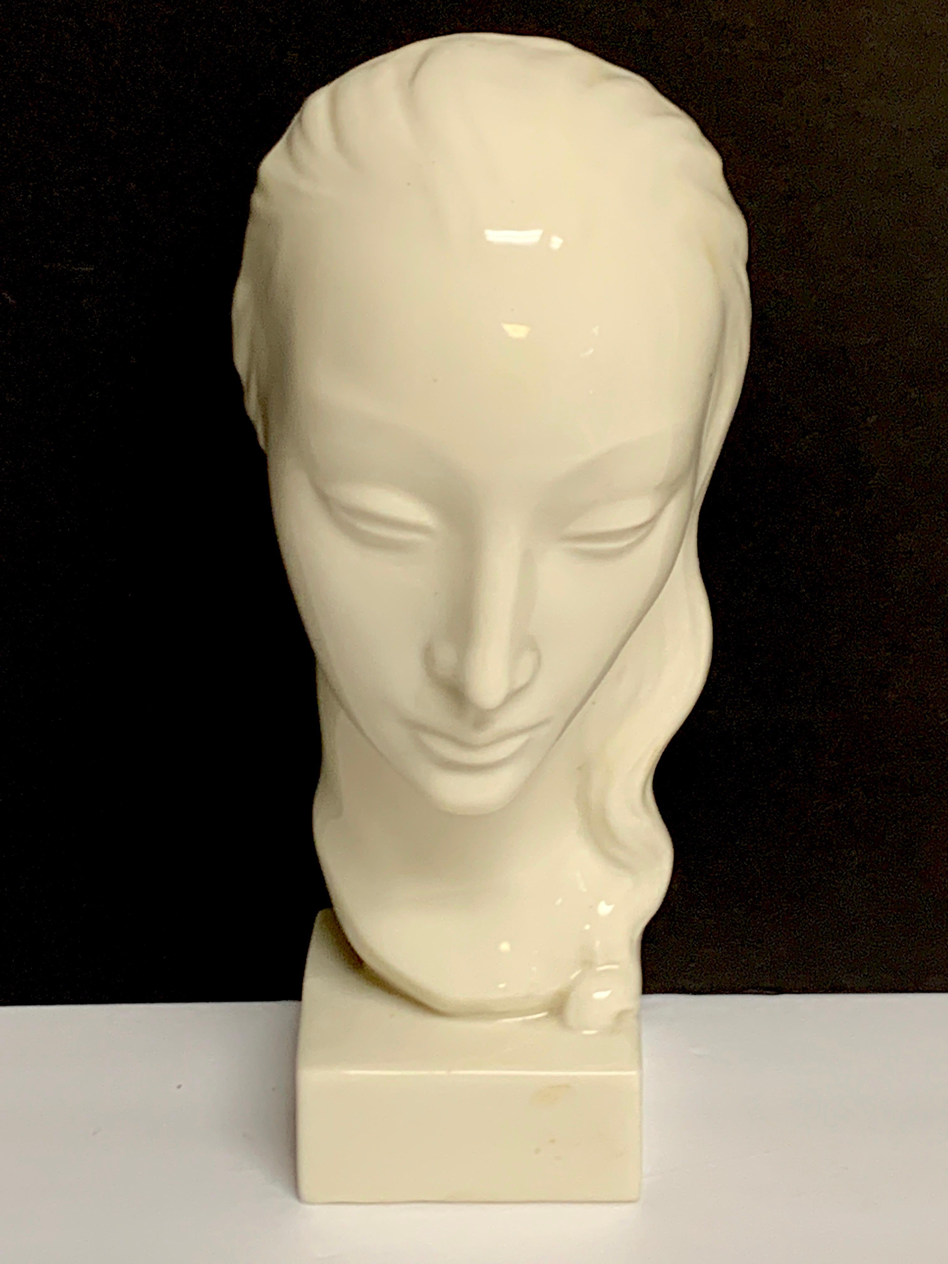 Art Deco Portrait Bust of a Woman, Geza De Vegh for Lenox
circa 1930s, raised on a 2.5