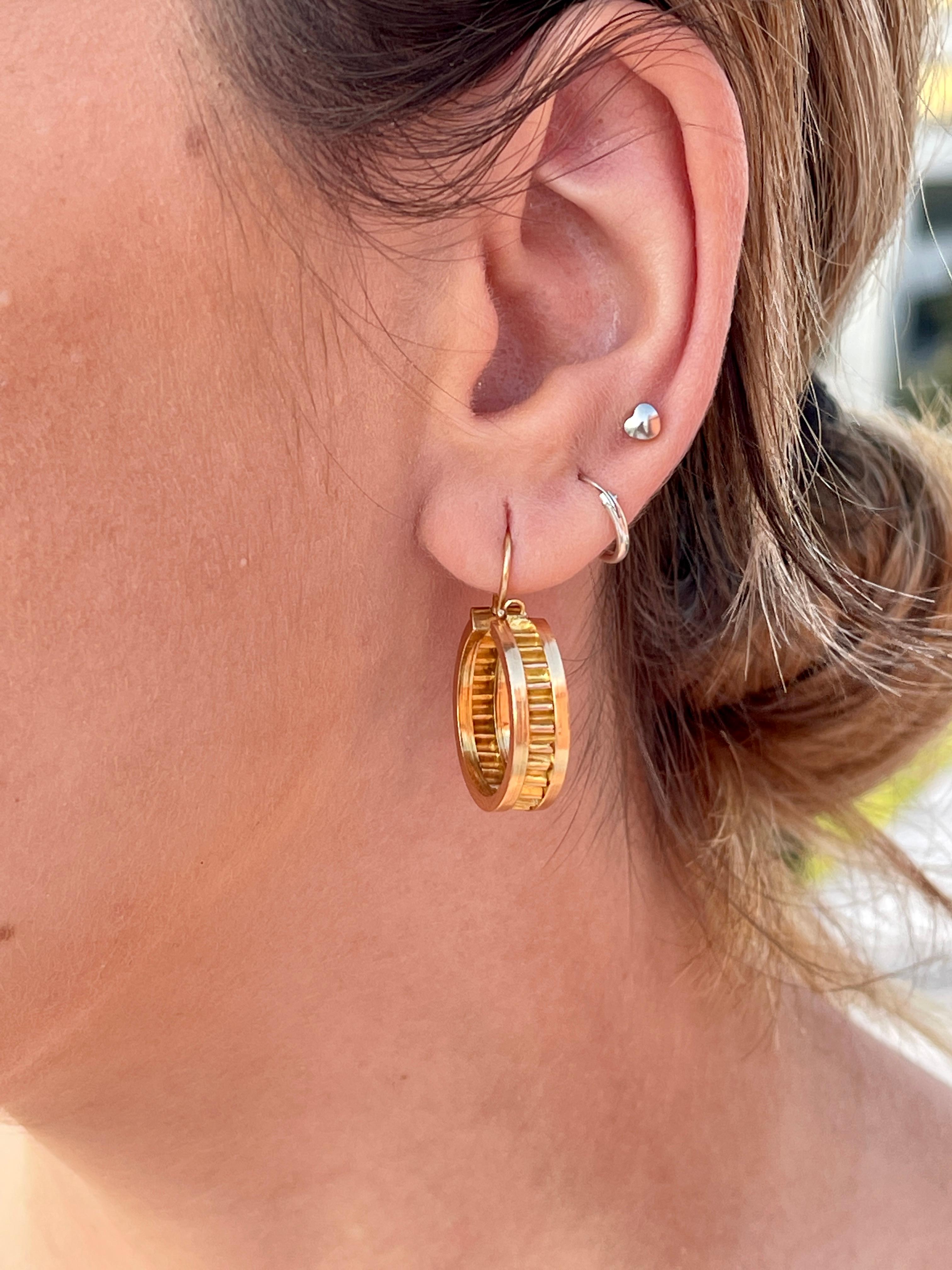 A Classic Pair of Timeless Art Deco Yellow Gold Hoop earrings.

Elegantly crafted in precious 19.2 Karat Portuguese Gold, and extremely comfortable, this ravishing pair of hoop earrings adds a striking touch to any look. 

Hallmarks from