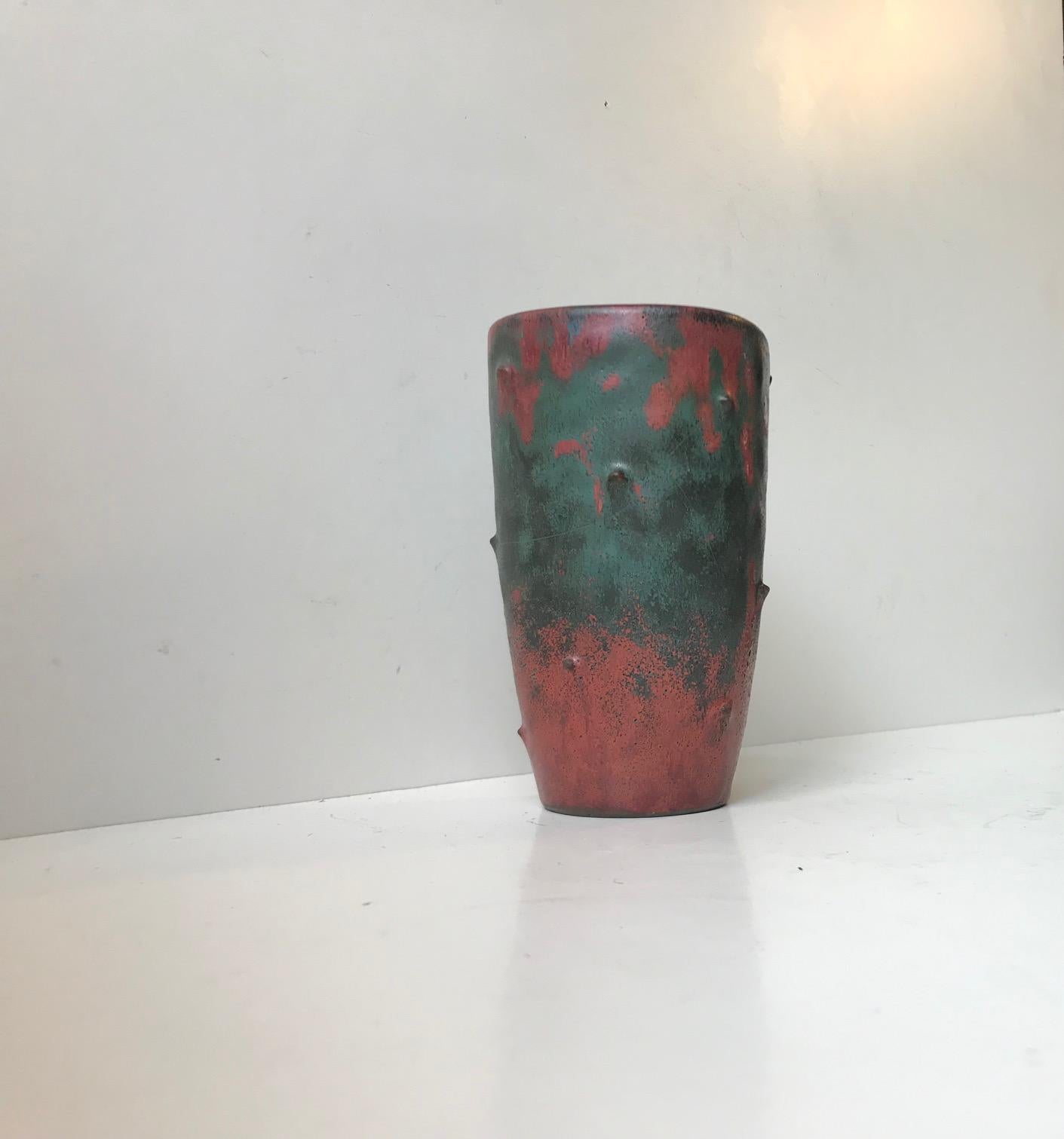Vase with spikes and Camouflage glaze designed by the Danish ceramist and founder of Danico Niels Peter Nielsen. This piece was created at Dagnæs Keramik during the 1930s or 1940s in a style reminiscent of Berndt Friberg, Stig Lindberg and Svend
