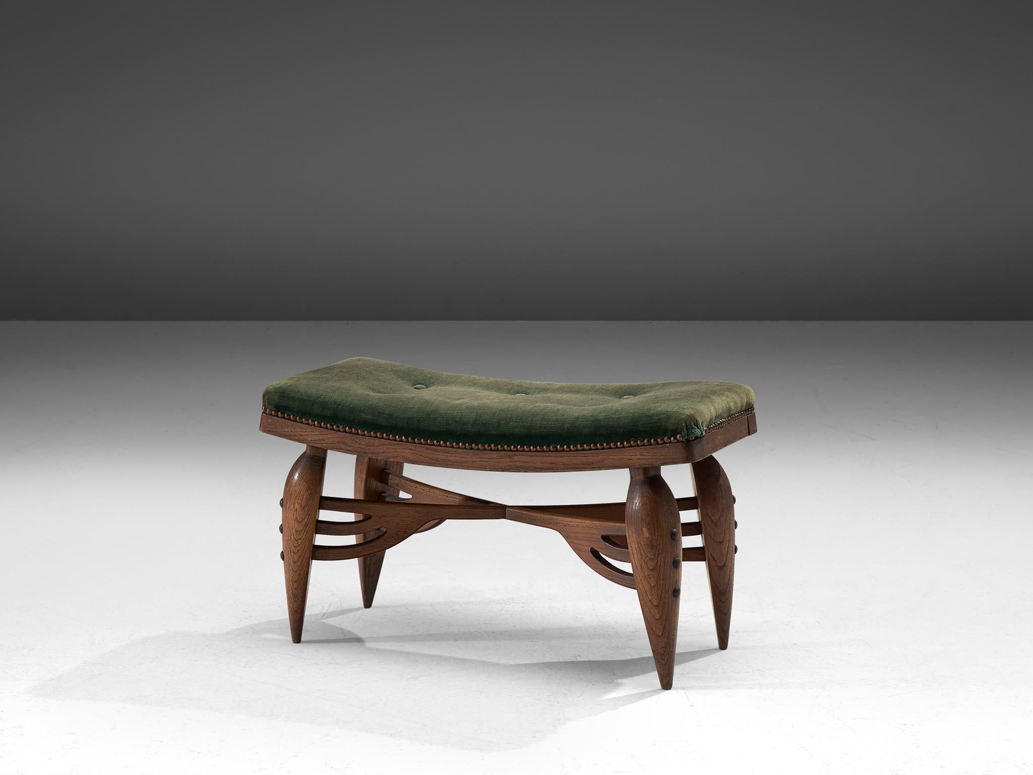 Art Deco pouf, oak and velours, France, 1930s

Beautiful sculptural stool in oak, upholstered in olive green velours. The characteristics of the Art Deco period are clearly visible. For instance, it shows curvilinear silhouettes in the wood work.