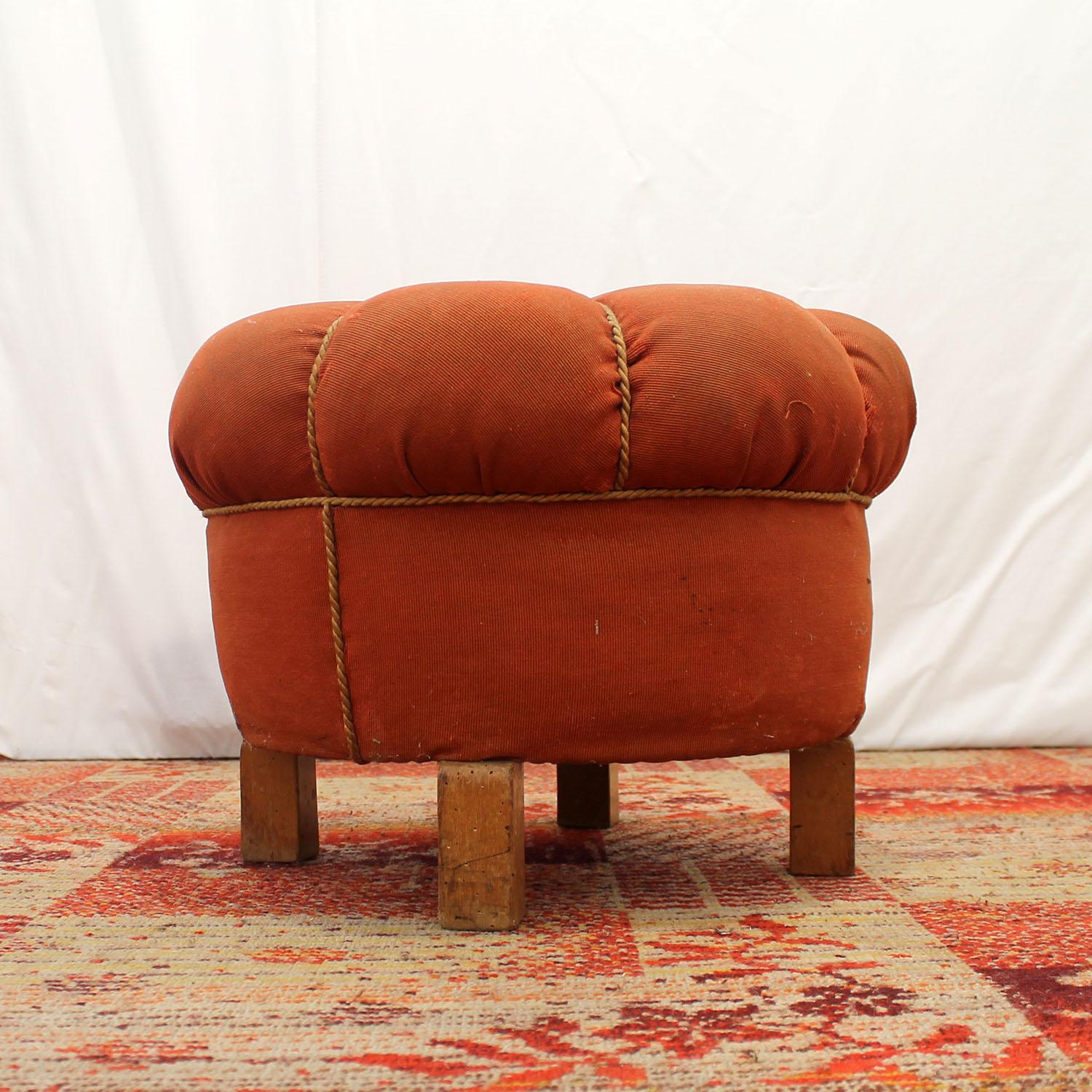 This pouffe (footstool) was designed by Jindrich Halabala and produced by UP Závody in the 1950s. Very comfortable retro chic. The upholstery and the wood showing significant signs of age and using. But the pouffe is stable.