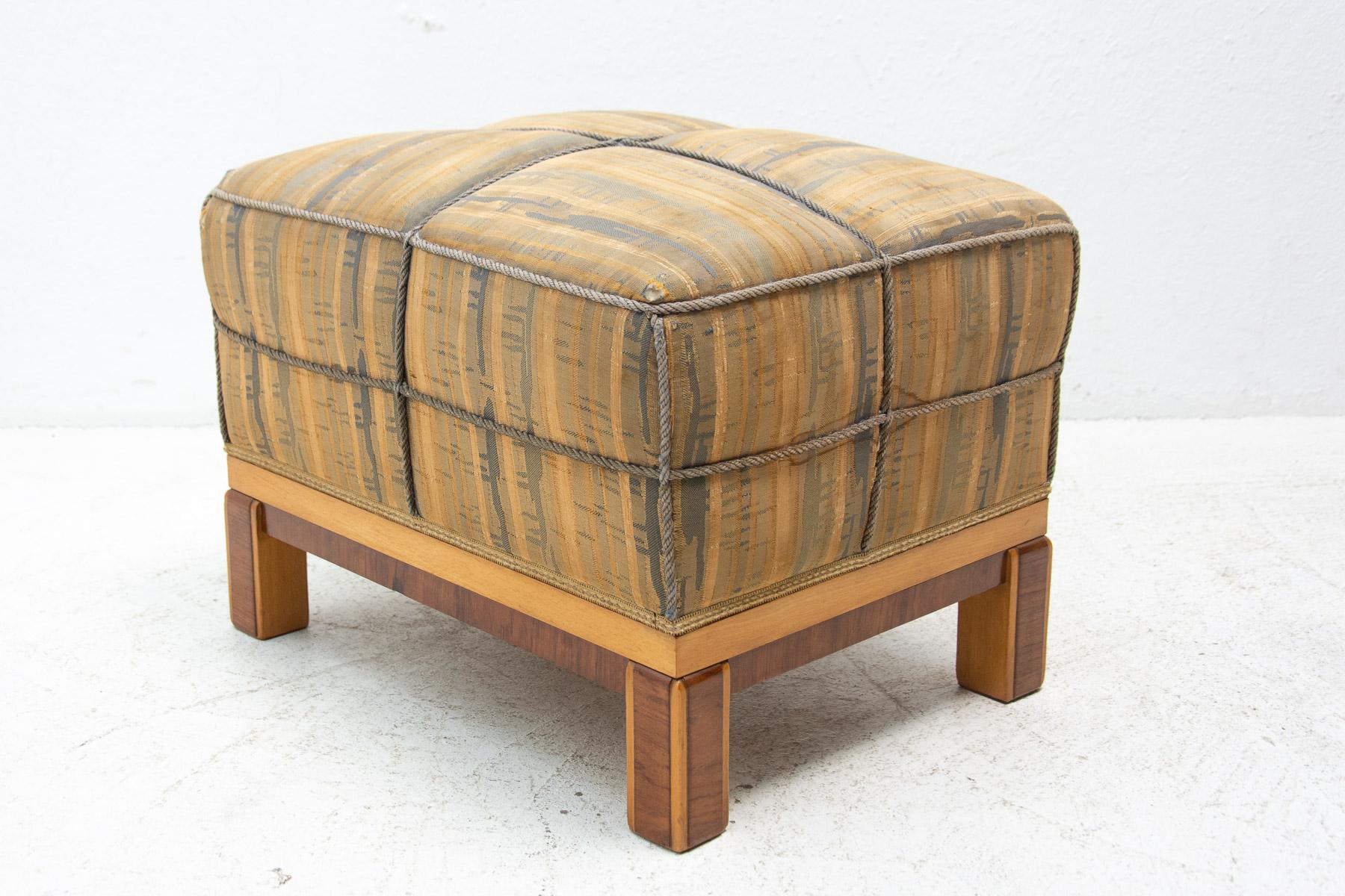 This pouffe(footstool) was made in the fromer Czechoslovakia in the 1940´s. A comfortable retro chic. Made of walnut and upholstery. In very good condition.

Dimensions:

Height: 39 cm

Width: 56 cm

Depth: 42 cm

Seat height: 39 cm.