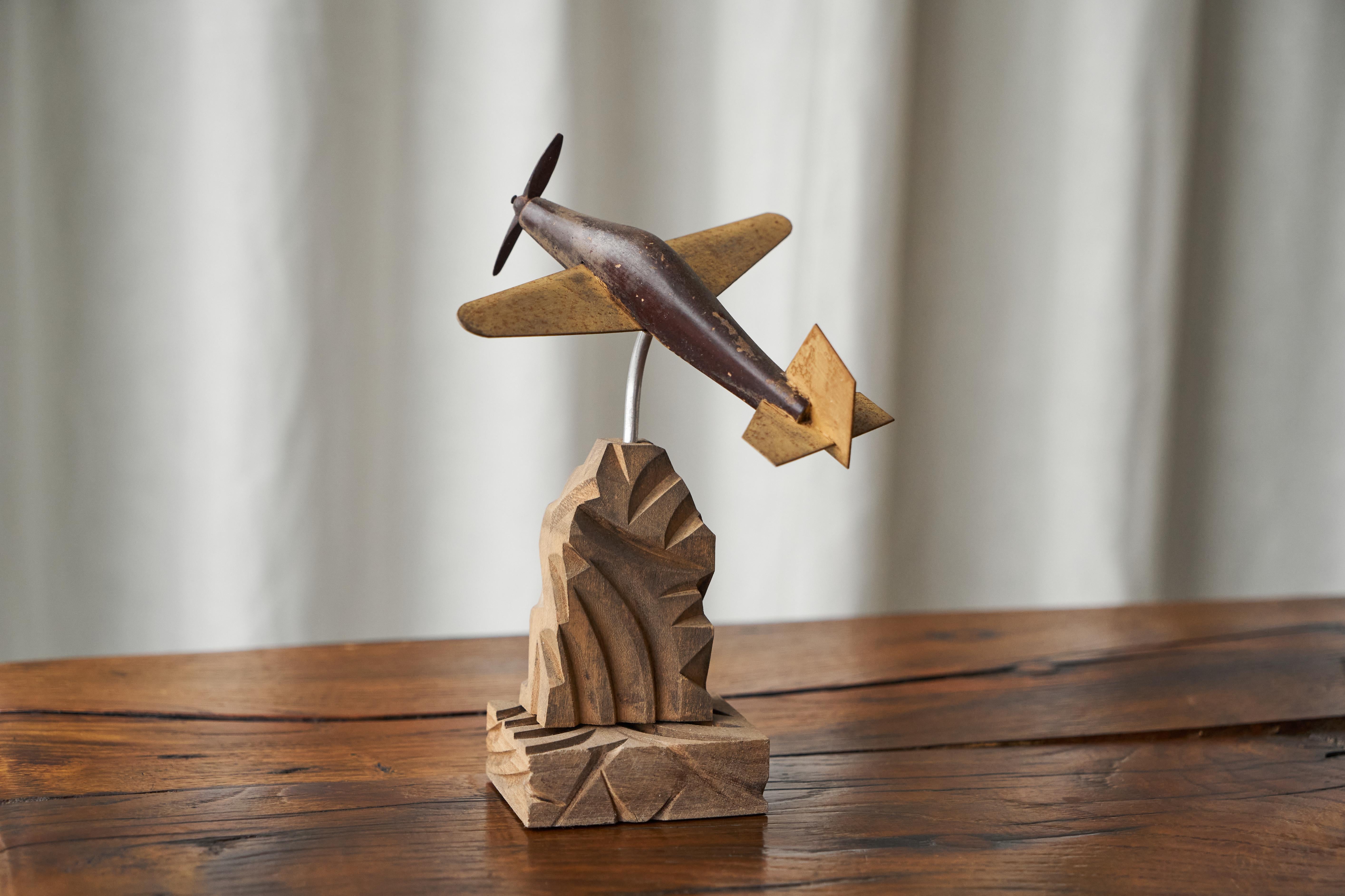 Art Deco Propeller Plane in Carved Wood and Metal

Sometimes you find a piece that is just right…. This Art Deco propeller plane is a wonderful example of a fun and easthetic object. Well made in wood and metal, placed in a dynamic position onto a