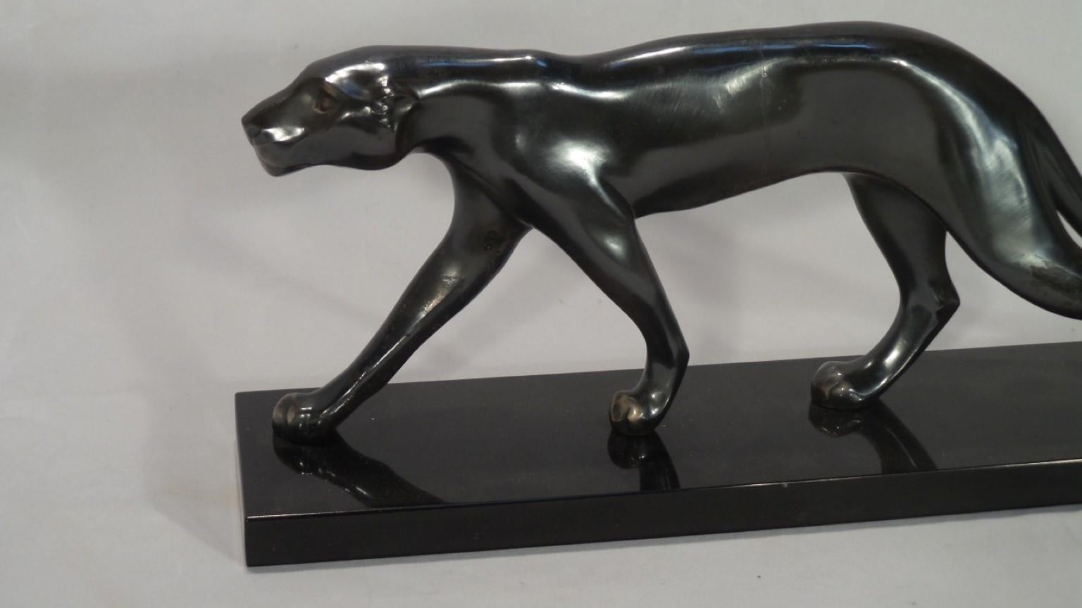 A wonderful Art Deco sculpture dating from circa 1930. The panther is in a burnished metal finish. It is set on a marble base. The sculpture has a powerful image the panther being full of movement and grace
The artist has not signed this piece but