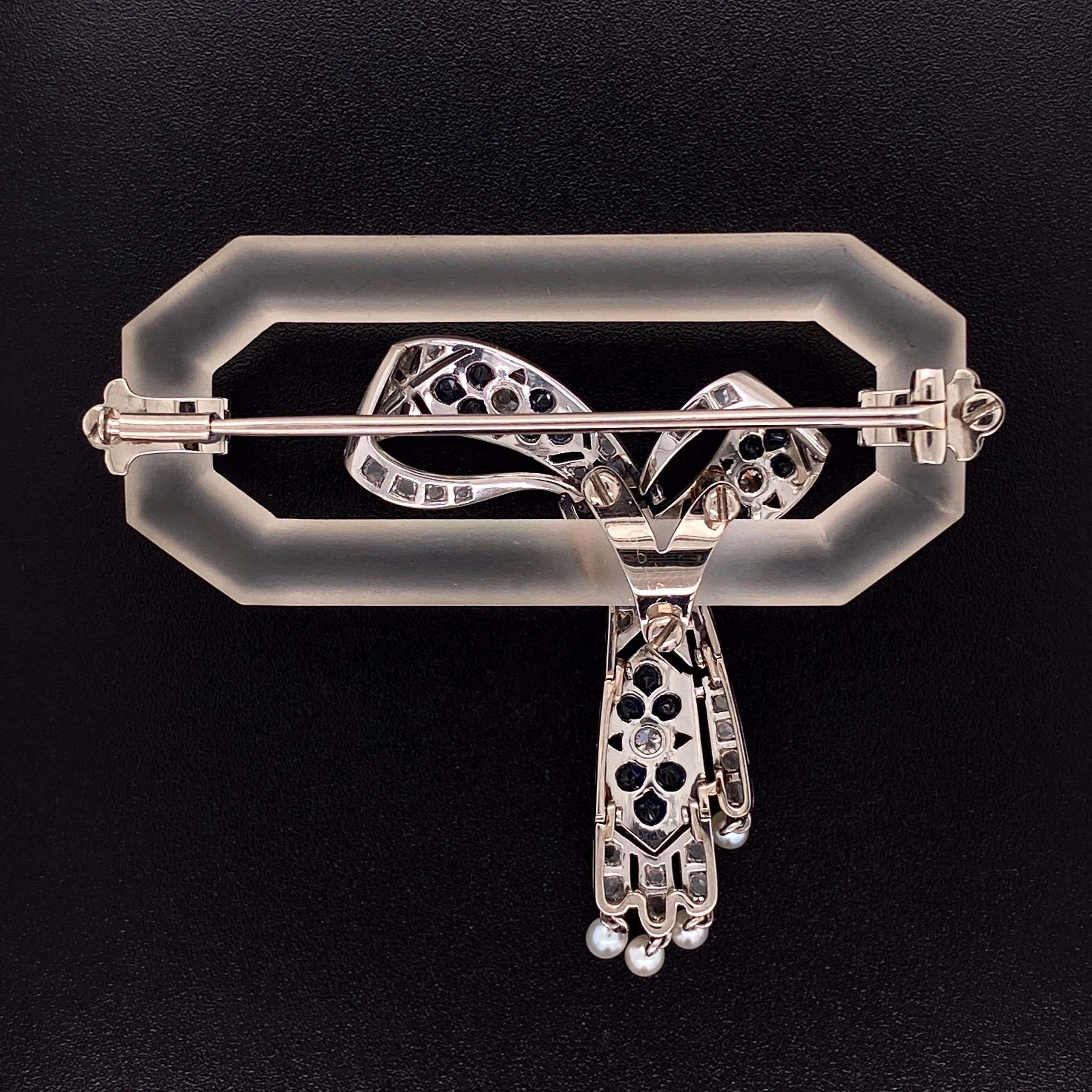 Simply Fabulous Art Deco Quartz Crystal, Diamond and Sapphire Hand crafted Platinum Brooch. Securely set with 50 rose cut diamonds, approx. 0.65tcw, 3 round diamonds approx. 0.18tcw, weighing approx. 0.83 total carat weight, 18 custom calibre blue