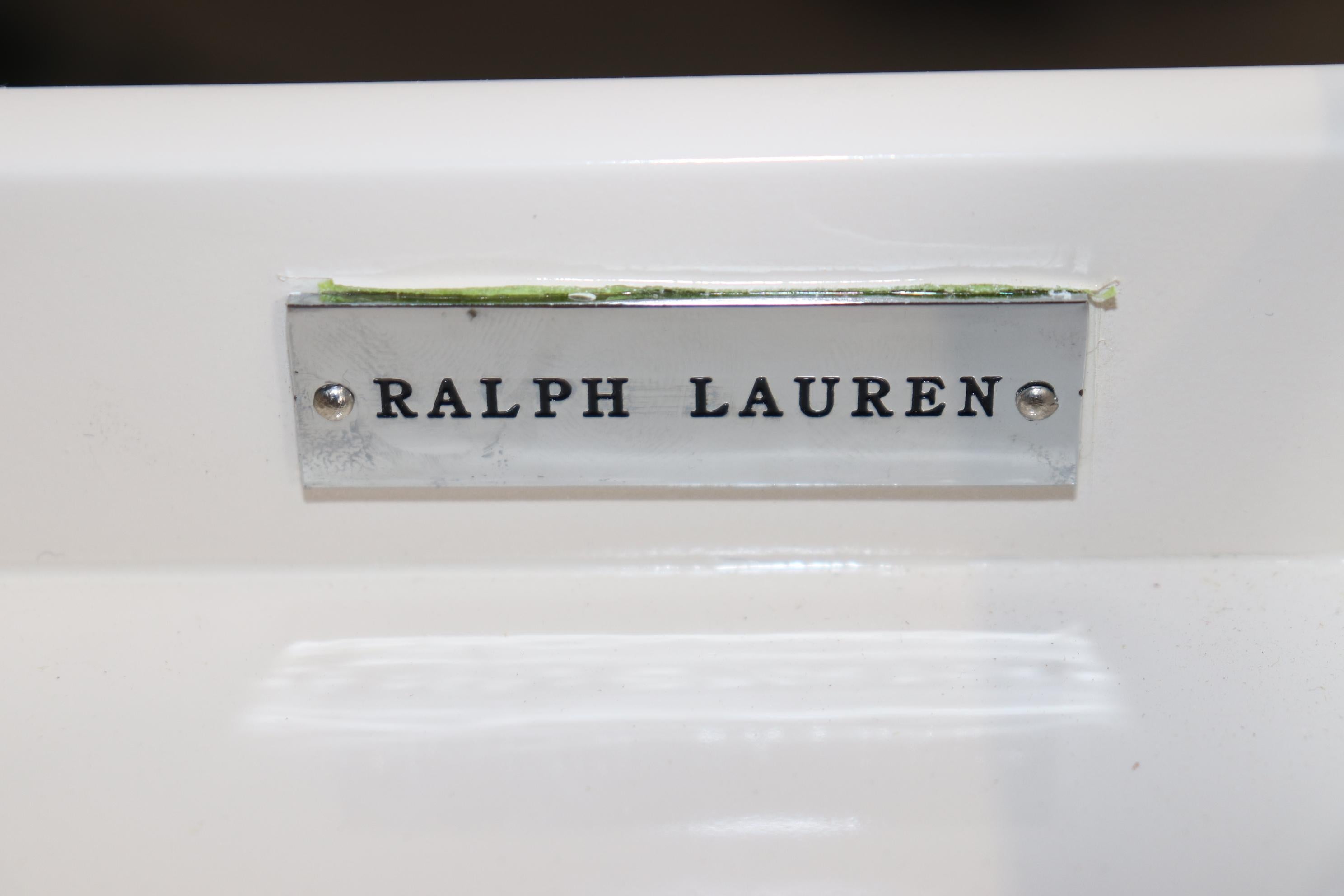 This is fantastic Art Deco style Ralph Lauren writing desk in white lacquer and nickel. The desk features the gorgeous and sophisticated lines that only Ralph Lauren could conjure up from the French past. The piece is in good condition with minor