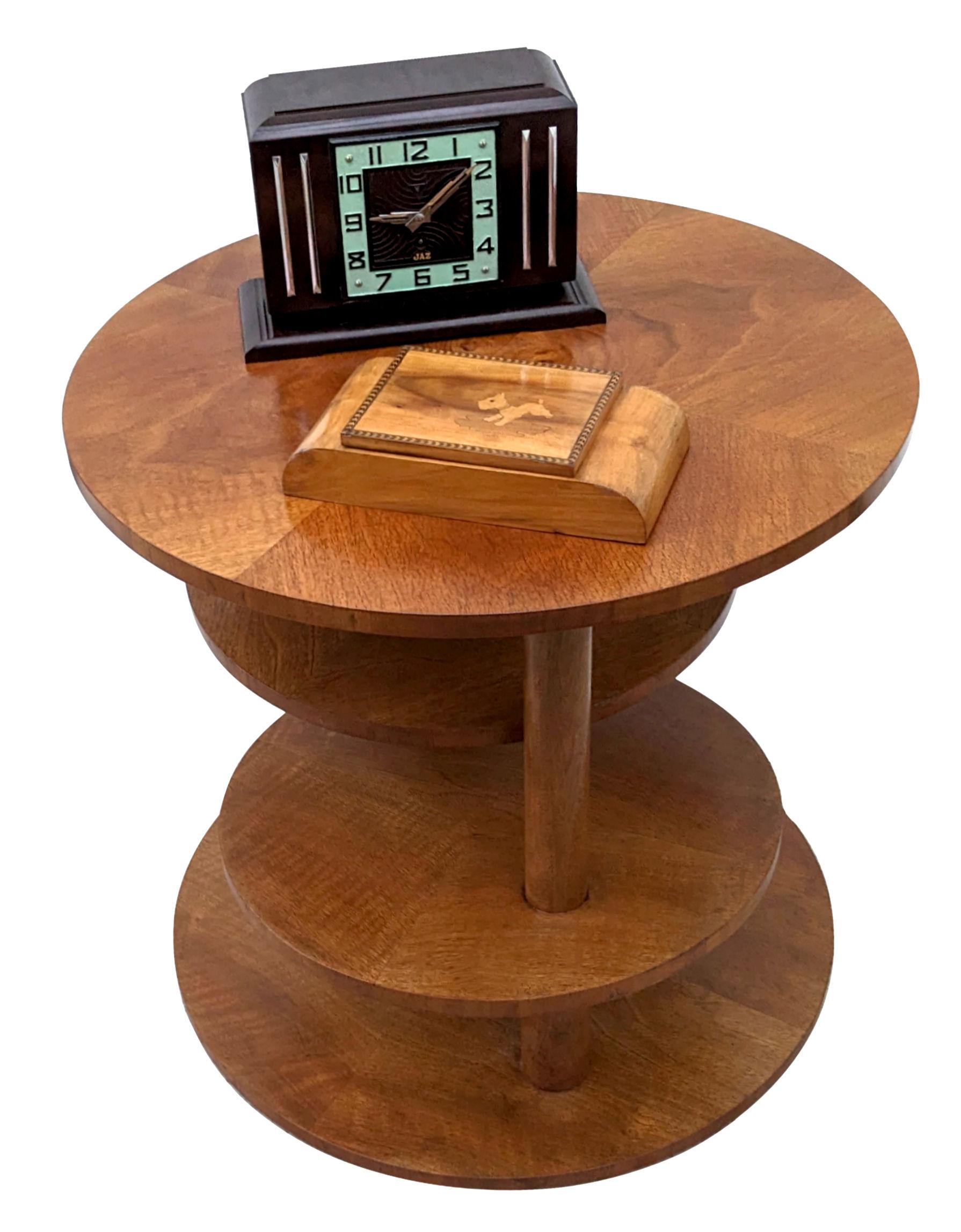 For your consideration and for those seeking the more unique pieces this table might be of interest. Quite substantial in size is this multi tiered circular table. The under tiers stack and fold in nicely, but these can also swing out offering more