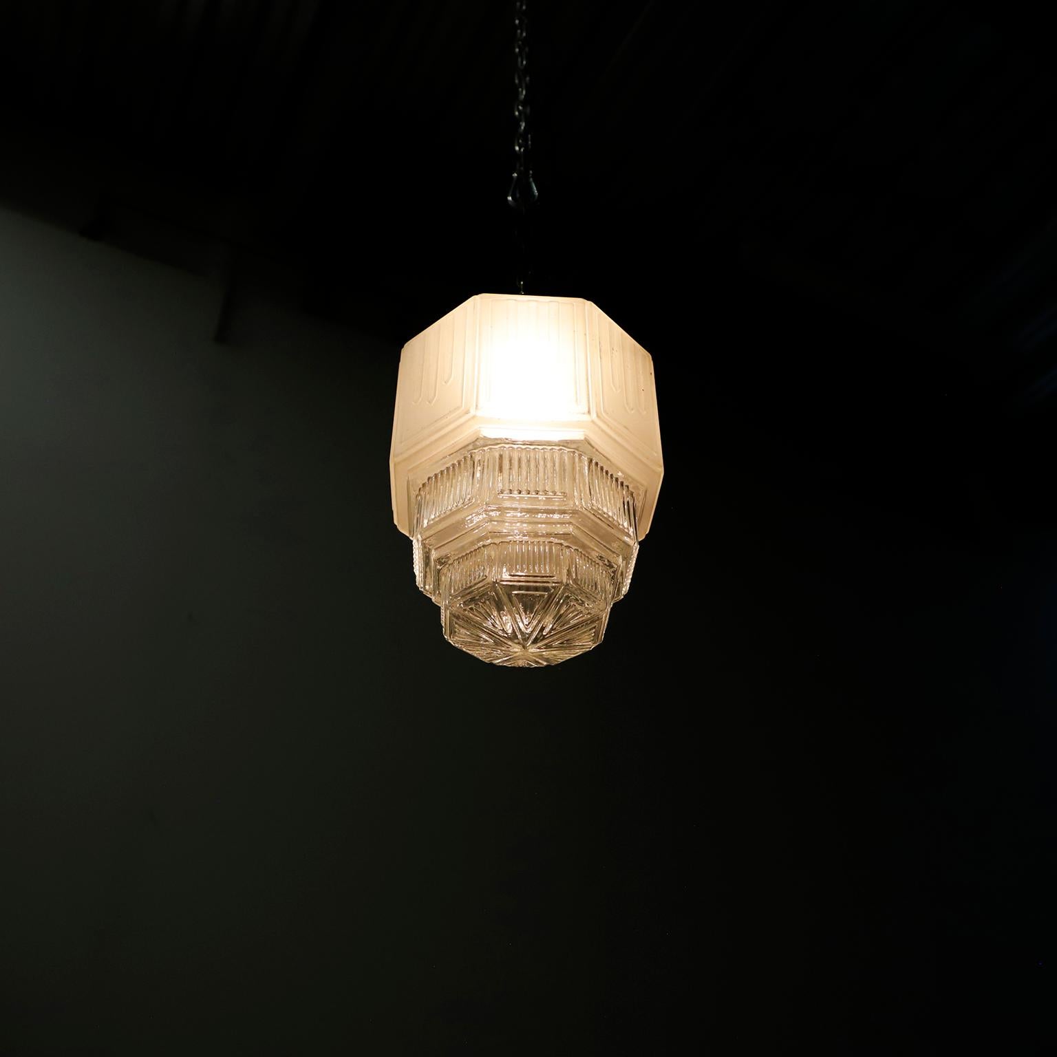 Circa 1930. We offer this Art Deco, pendant light made in opaline and transparent glass. Excellent vintage conditions.