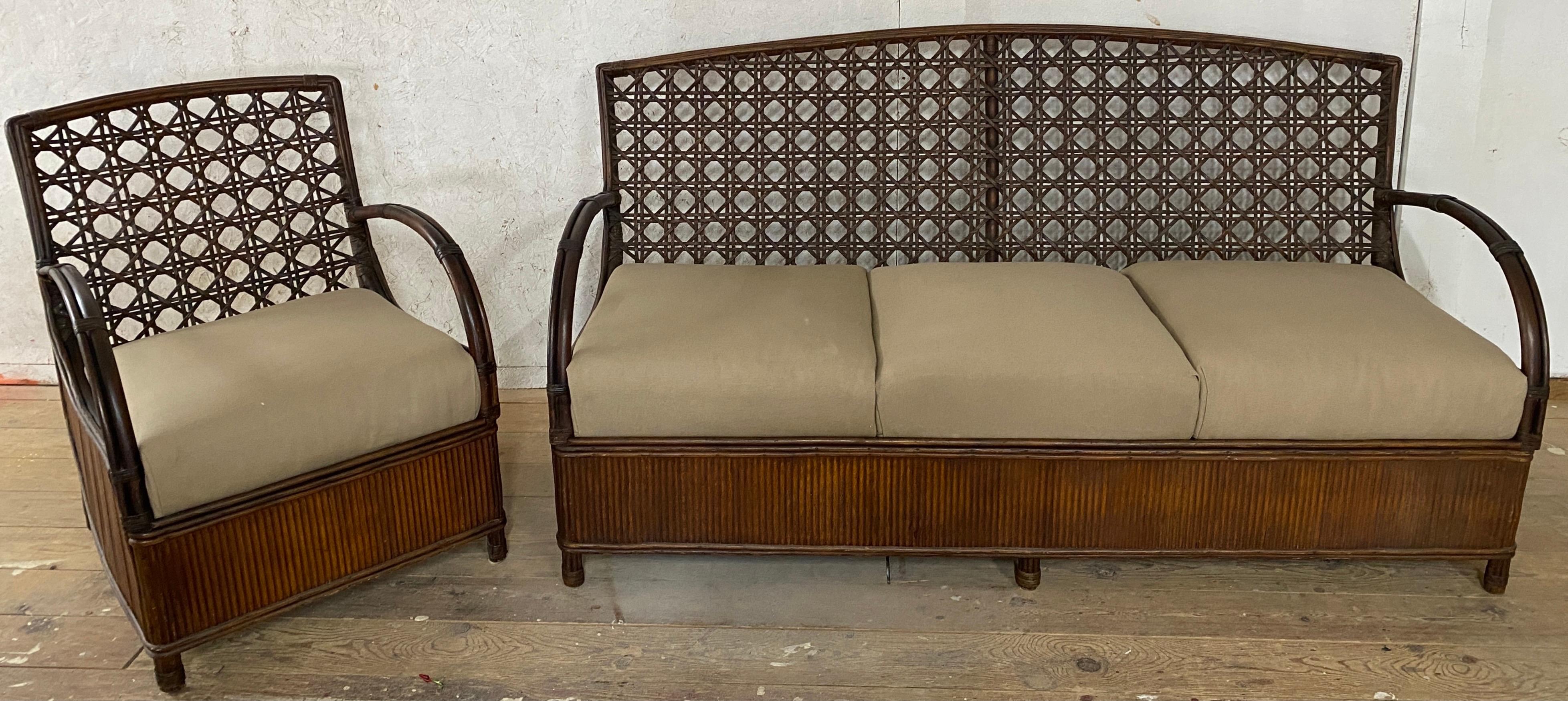 A highly stylish Art Deco inspired rattan sofa and club arm lounge chair.
The set will make a statement on any porch or patio. 
Measures: Sofa: AH 23.38, SH 11 3/8 w/o cushion
Chair: 31.5 H x 27 D x 23.5 W / ah 23.75 / sh 16.5 / sh 11.5 w/out