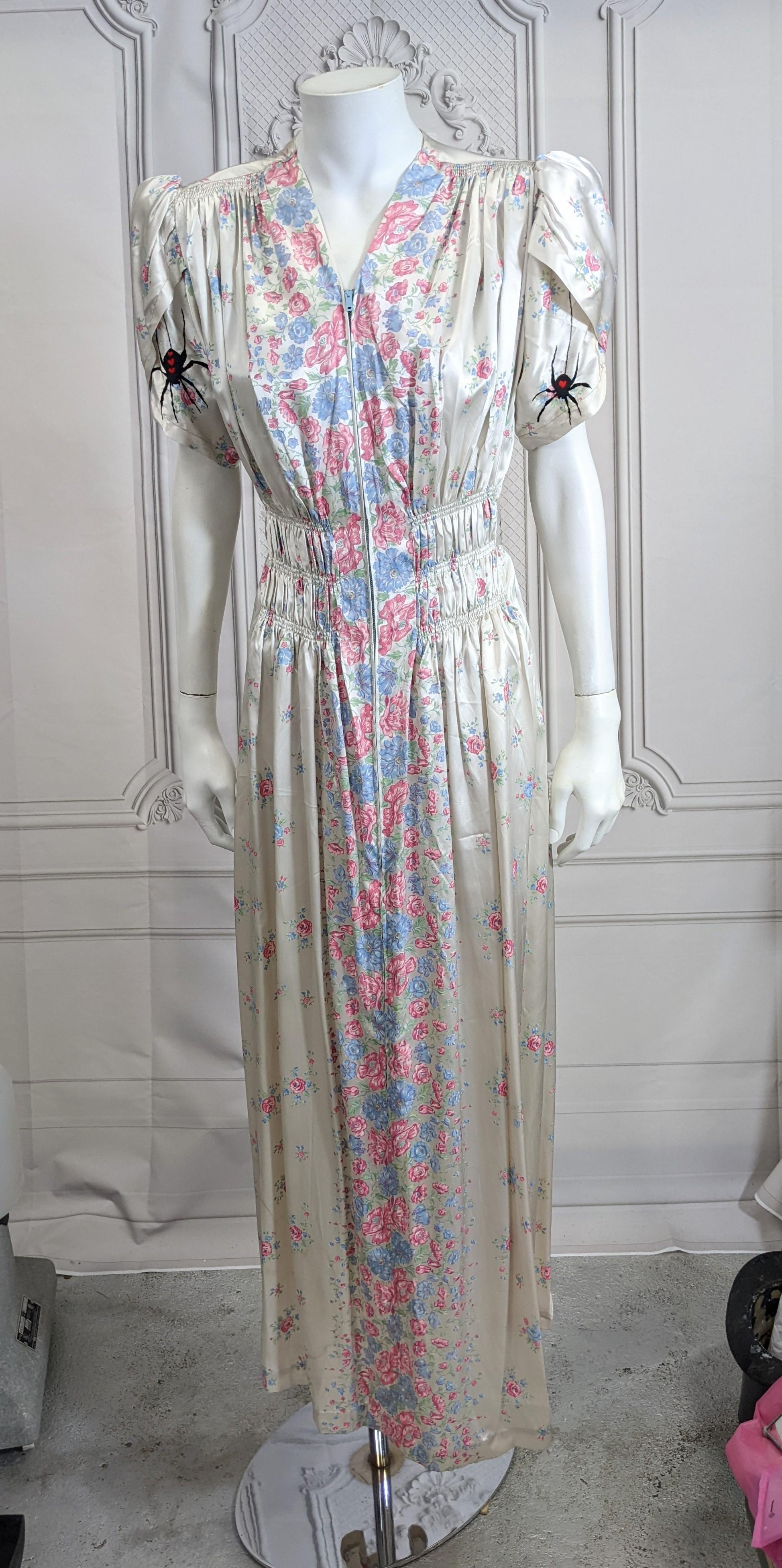 Creepy and cool pale blue rayon floral gown with hand embroidery, Studio VL. Period rayon satin floral dressing gown with front zip entry, hand embroidered with hidden black widow spiders under the petal sleeves and waterbugs along the back belt.
