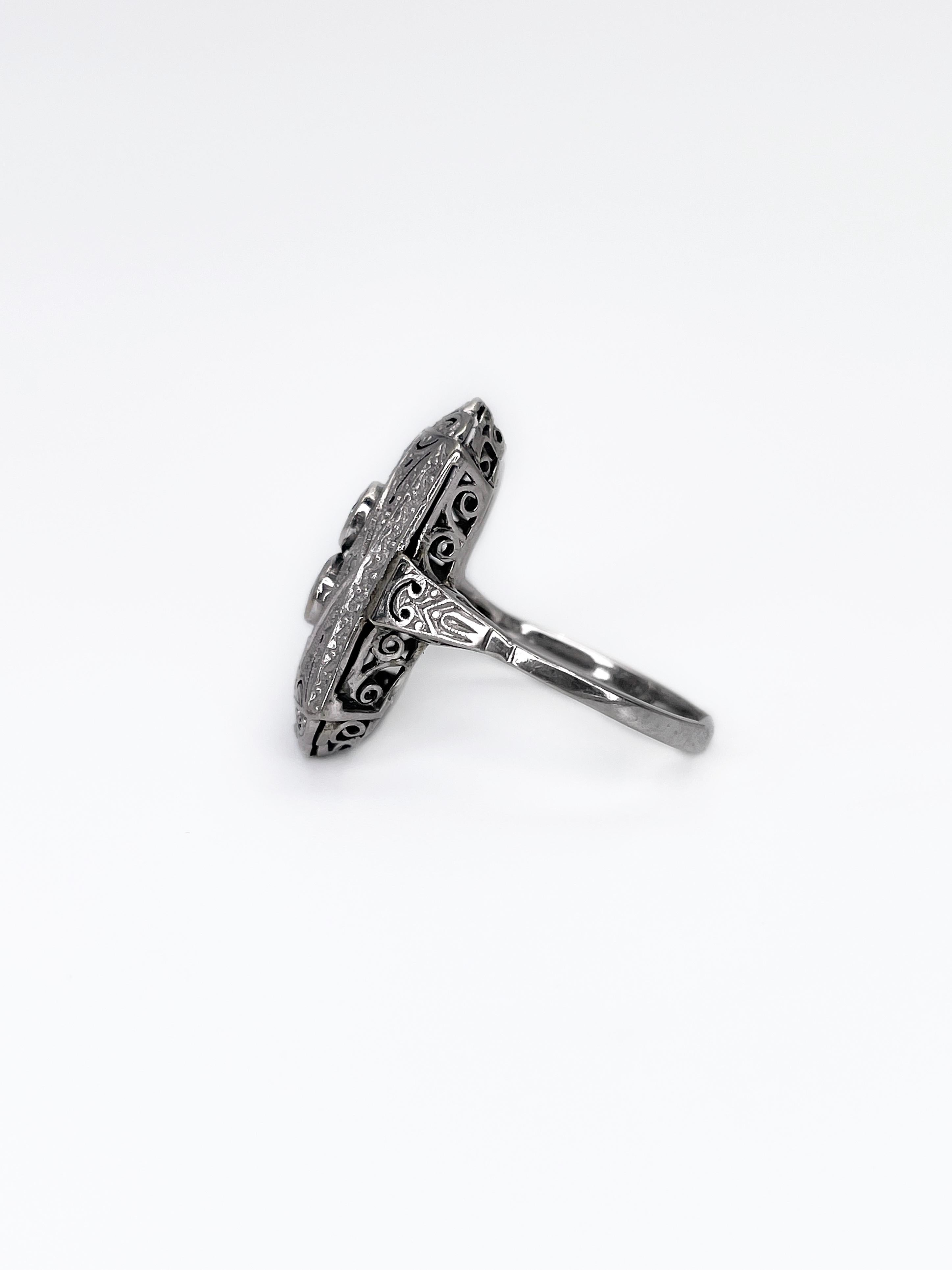 It is a stunning example of an Art Deco era jewelry. This is a fabulous rectangle ring in 14K white gold. It features two round brilliant cut 0.32ct diamonds (colour: STW-Tinted, clarity: SI-P2). Each of these gems are surrounded by intricate