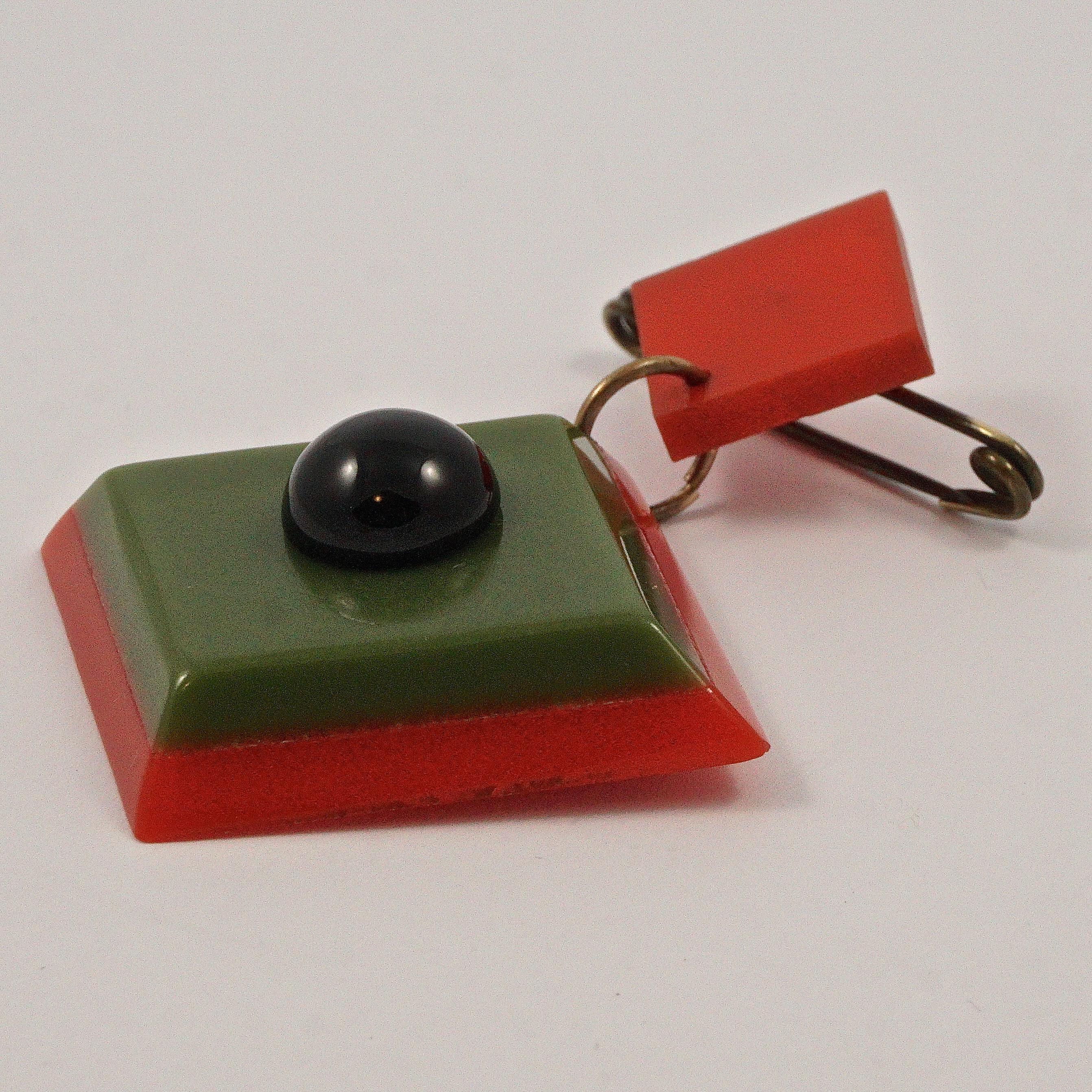 Women's or Men's Art Deco Red and Green Early Plastic and Black Glass Geometric Brooch For Sale