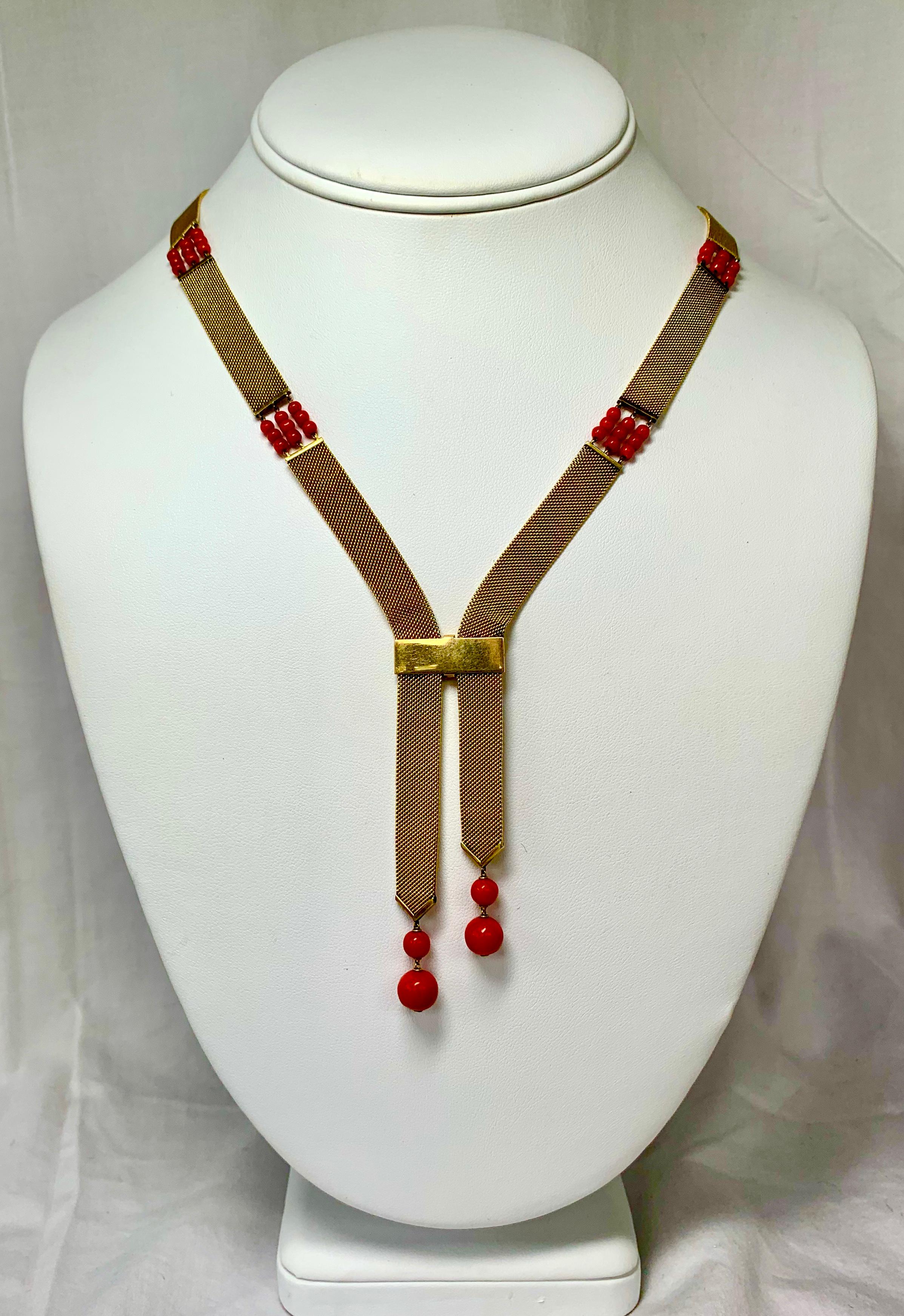 THIS IS A STUNNING ART DECO - EDWARDIAN - VICTORIAN NEGLIGEE NECKLACE OF GREAT BEAUTY.  THE NECKLACE IS COMPOSED OF GOLD MESH BANDS IN 14 KARAT GOLD.  THE MESH BANDS ARE DECORATED WITH CHAINS OF NATURAL RED CORAL BEADS AND THE TWO PENDANT ENDS HAVE
