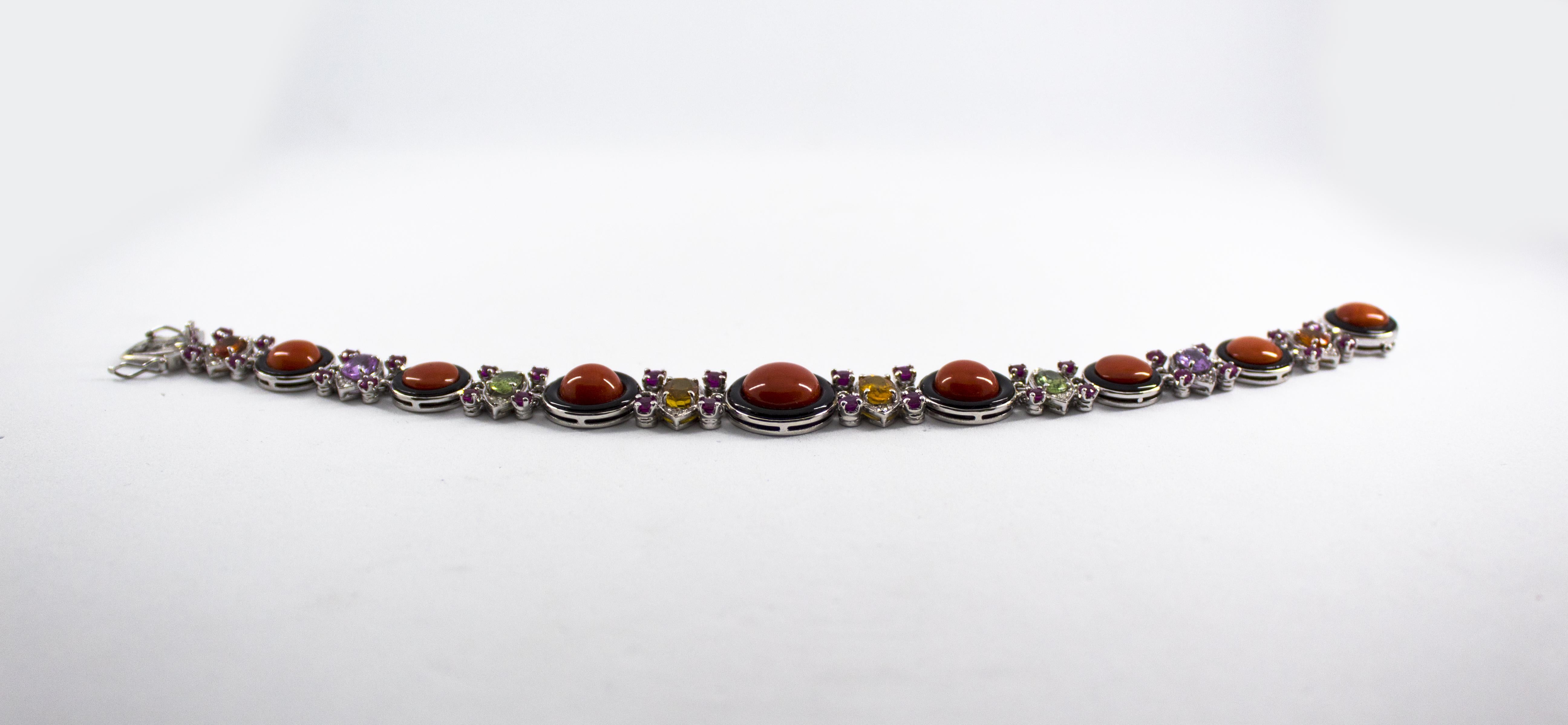 This Bracelet is made of 14K White Gold.
This Bracelet has 0.30 Carats of White Modern Round Cut Diamonds.
This Bracelet has 3.20 Carats of Rubies.
This Bracelet has 6.80 Carats of Colored Sapphires (Green, Pink and Yellow).
This Bracelet has also
