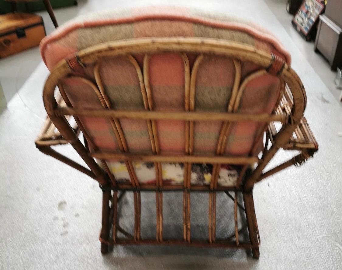 Pink and gray plaid pillows and barkcloth borders adorn this rattan lounger with matching ottoman. Ottoman dimensions are 21.5 x 23.25 x 16 high. Circa 1940s. Note the welting on the pillows - it's pink mohair no less.
Newly reupholstered.