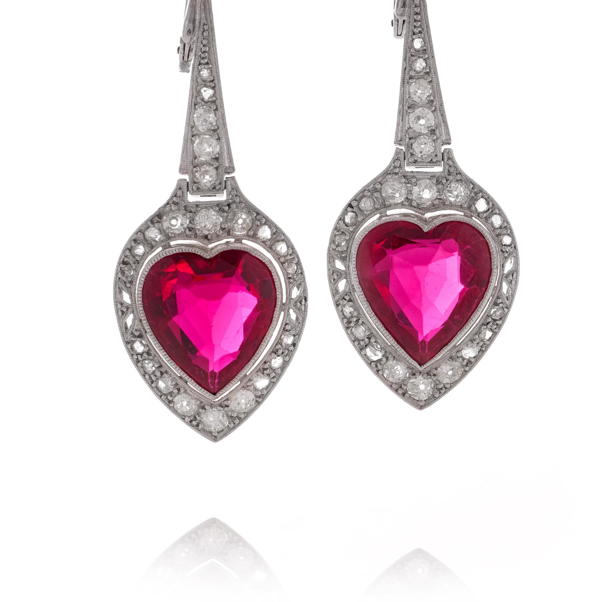 Art Deco-inspired platinum pair of heart-shaped rubies, old European and single cut - diamond earrings.
X-Ray has been tested positive for Platinum.

Dimensions -
Weight: 13.00 grams
Size: length x width: 4.8 x 1.8 cm

Diamonds -
Cut: Single-cut and