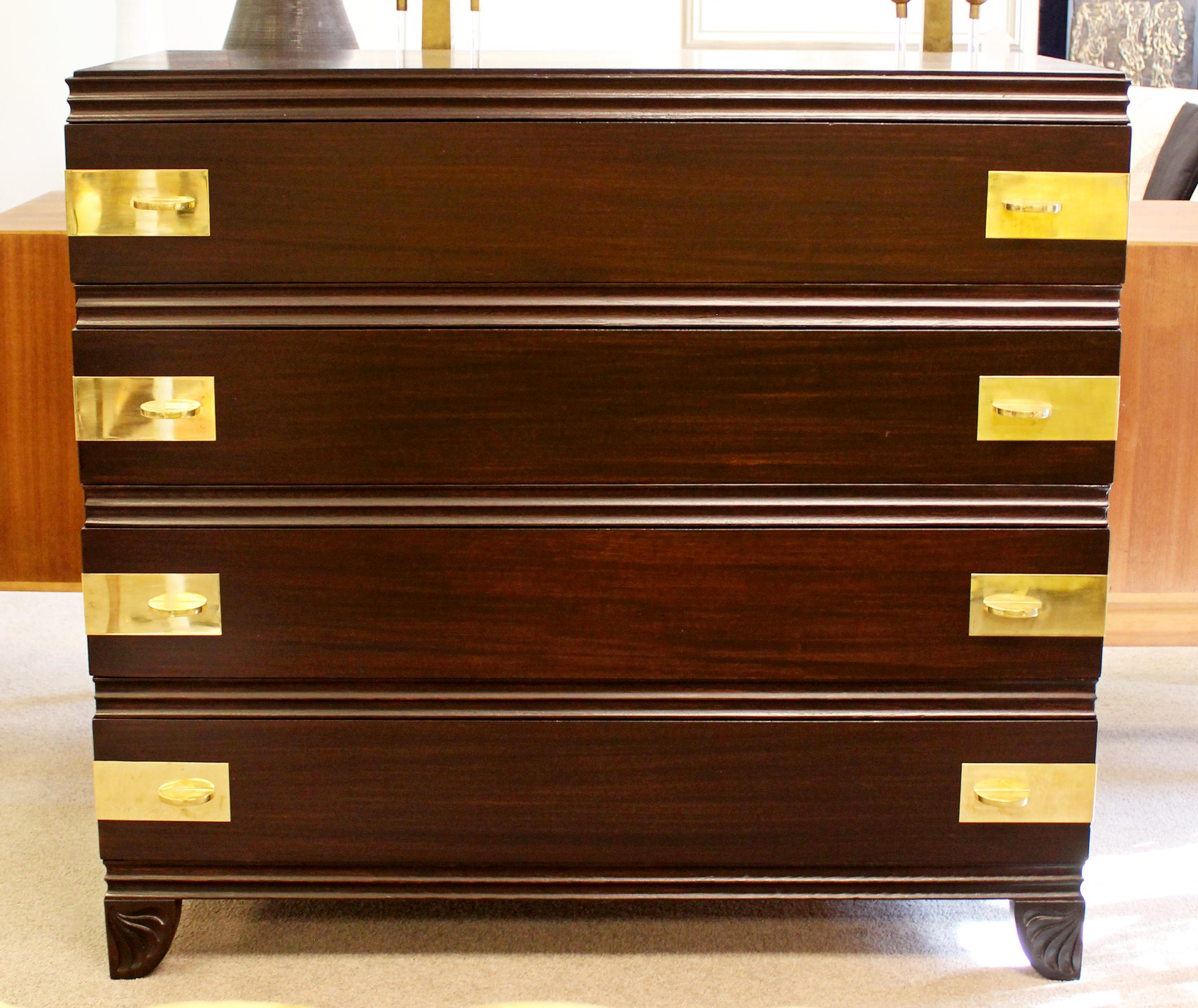 For your consideration is an incredible, ebonized mahogany, four drawer chest dresser, with brass pulls, by John Widdicomb, circa 1938. In excellent condition, newly restored. The dimensions are 43.5 W x 21