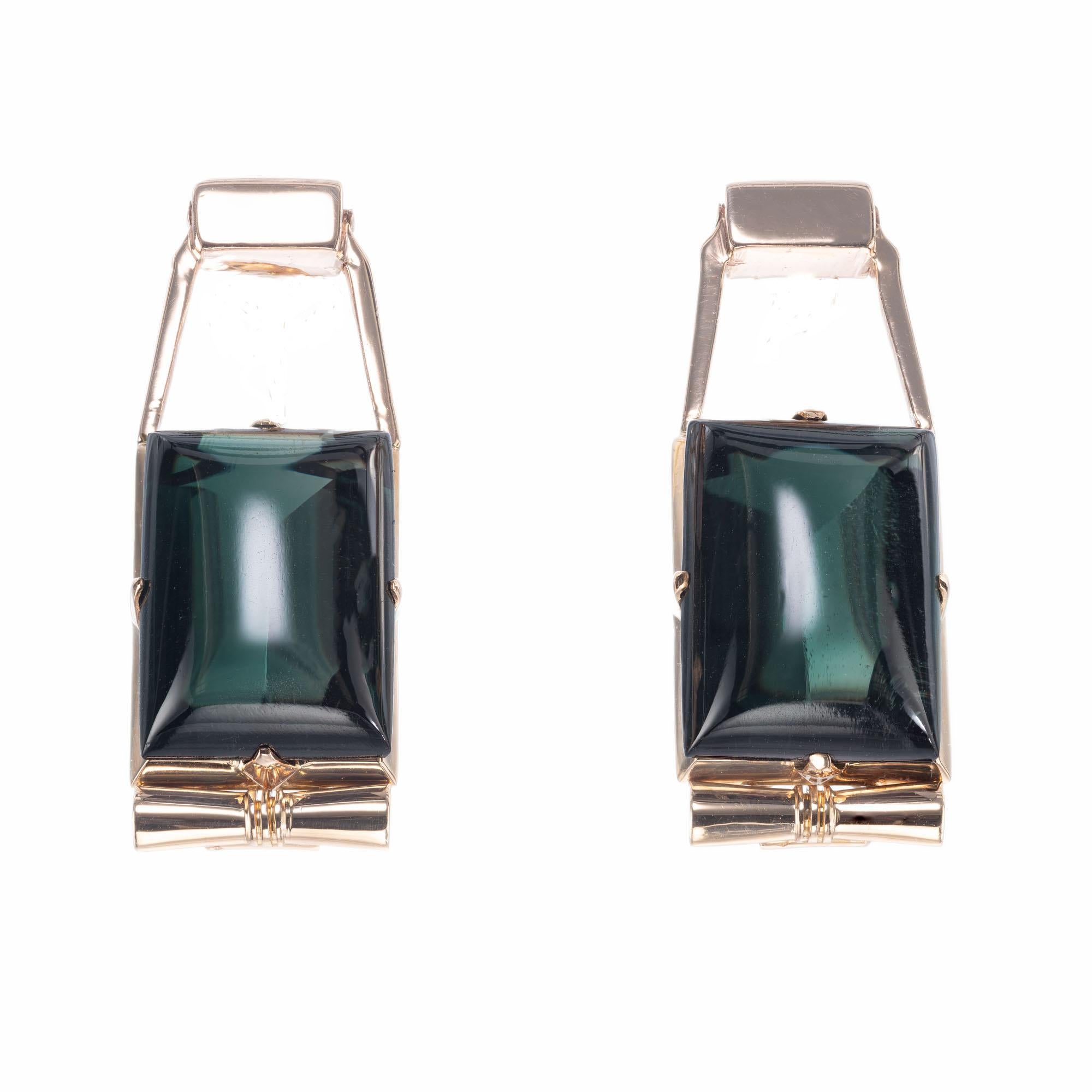 Original 1930's to 1940 Retro Art Deco dangle domed green Tourmaline earrings in rose gold settings.  

2 Emerald cut deep green cabochon Tourmaline, approx. total weight 24.00ct, VS, 16 x 11.2 x 7.5mm
14k Rose Gold
13.2 grams
Tested: 14k
Stamped: