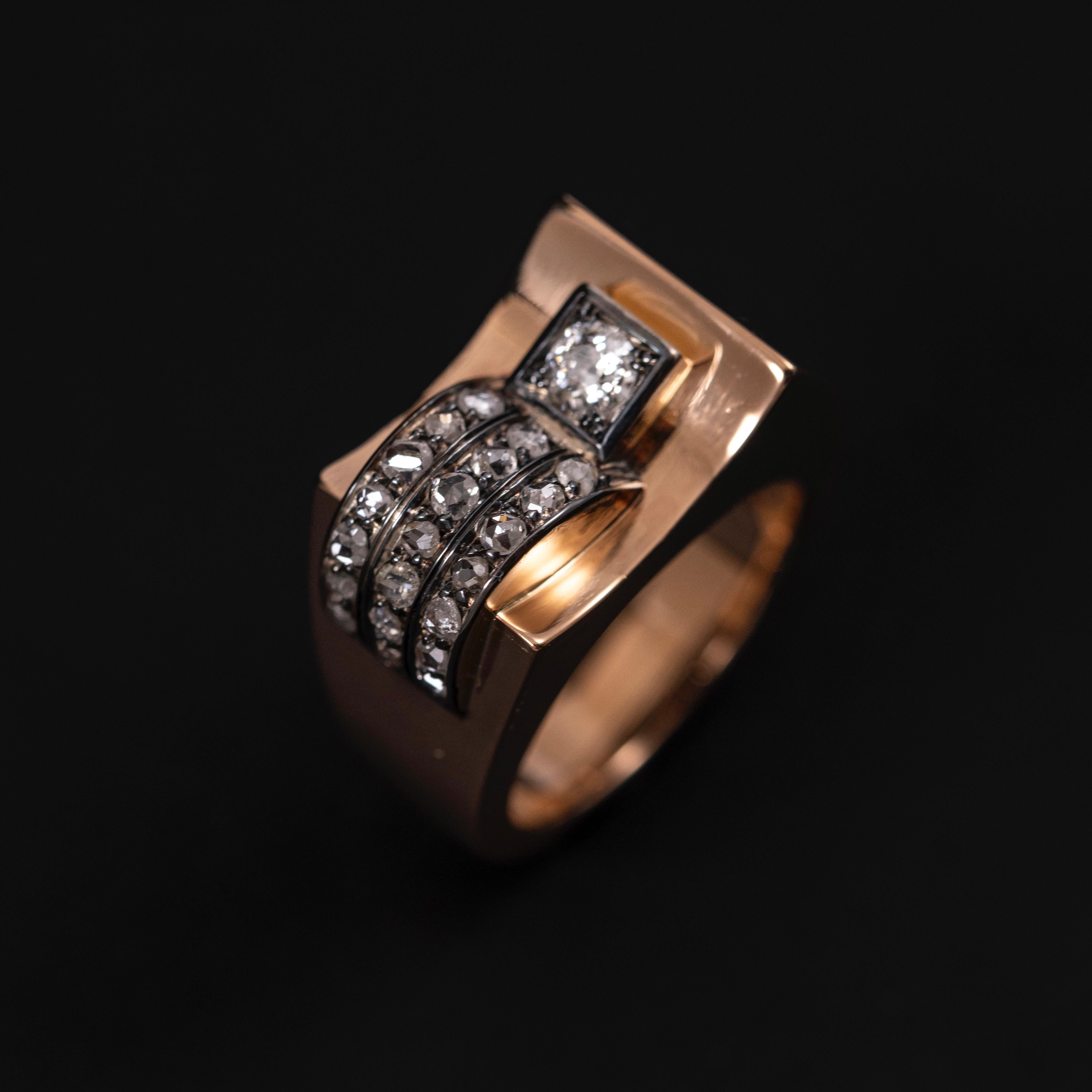 Diamond Odeonesque Retro Ring in Rose Gold and Silver, Portuguese, 1940s. Set with an old European brilliant-cut diamond and rose-cut diamonds, this bold, architectural Odeonesque ring is a radiant tribute to the streamlined glamour of the 1940s.