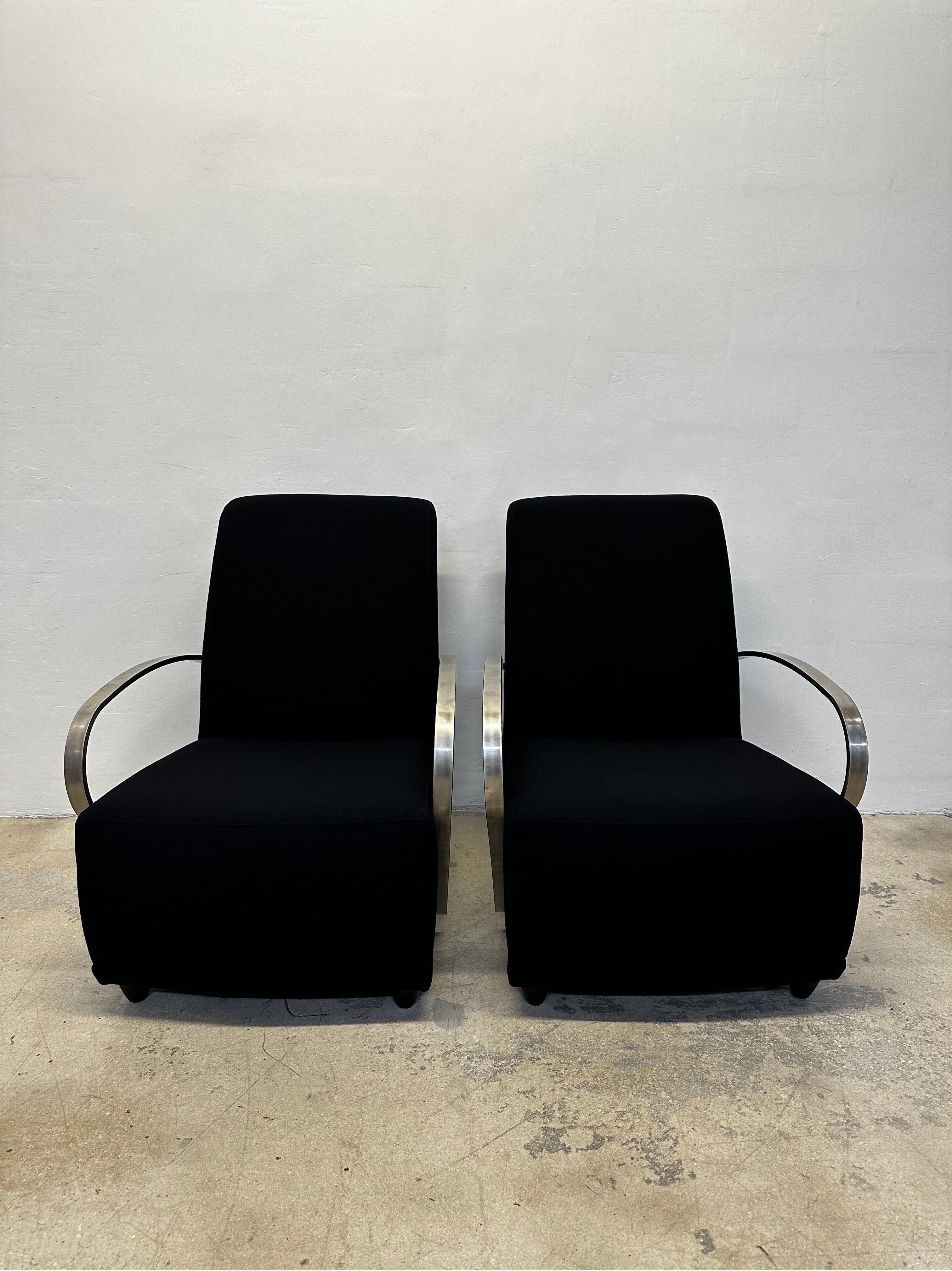 Pair of exceptional Art Deco Revival black fabric lounge chairs with curved steel arms by Directional Furniture circa 1980s.  The fabric is original and in near perfect condition.
