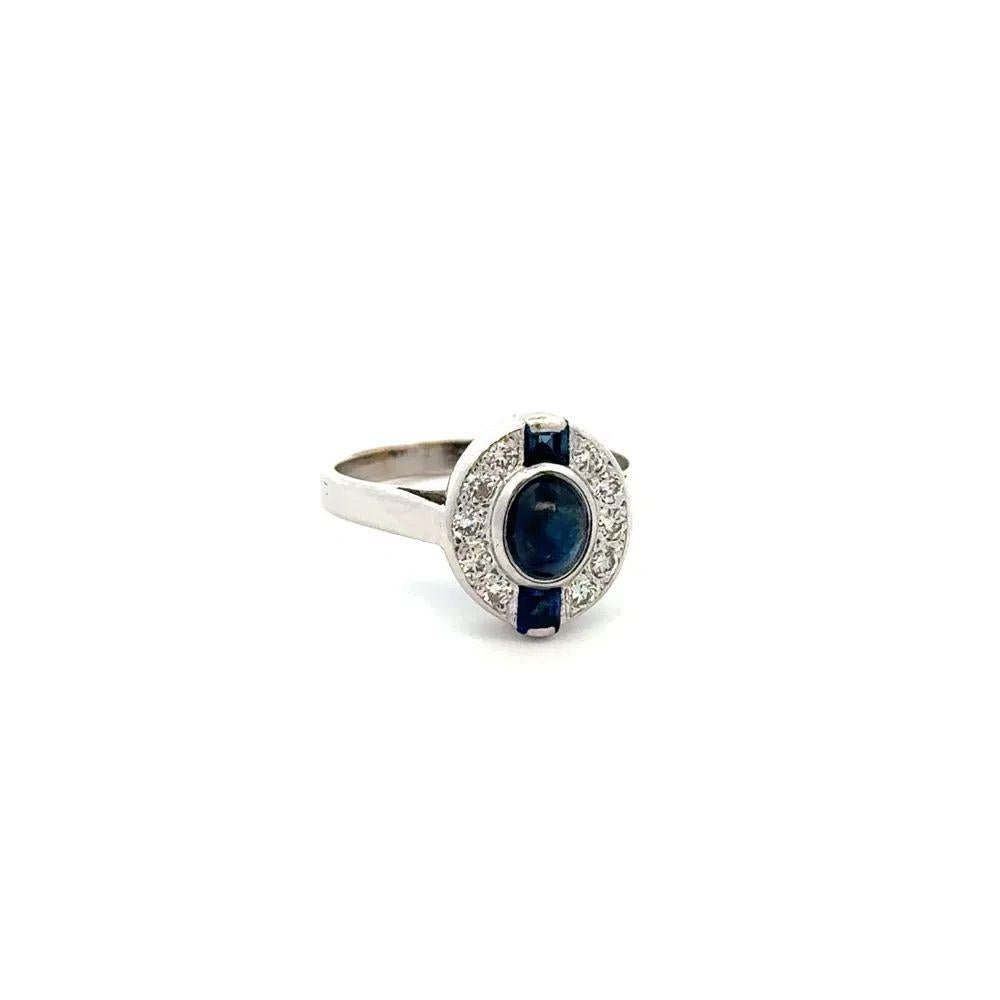 Simply Beautiful! Art Deco Revival Blue Sapphire and Diamond Gold Solitaire Ring. Centering a securely nestled Hand set Blue Sapphire Diamond, weighing approx. 0.65 Carat. Accented by Blue Sapphires and surrounded by Diamonds, approx. 0.10tcw. Hand