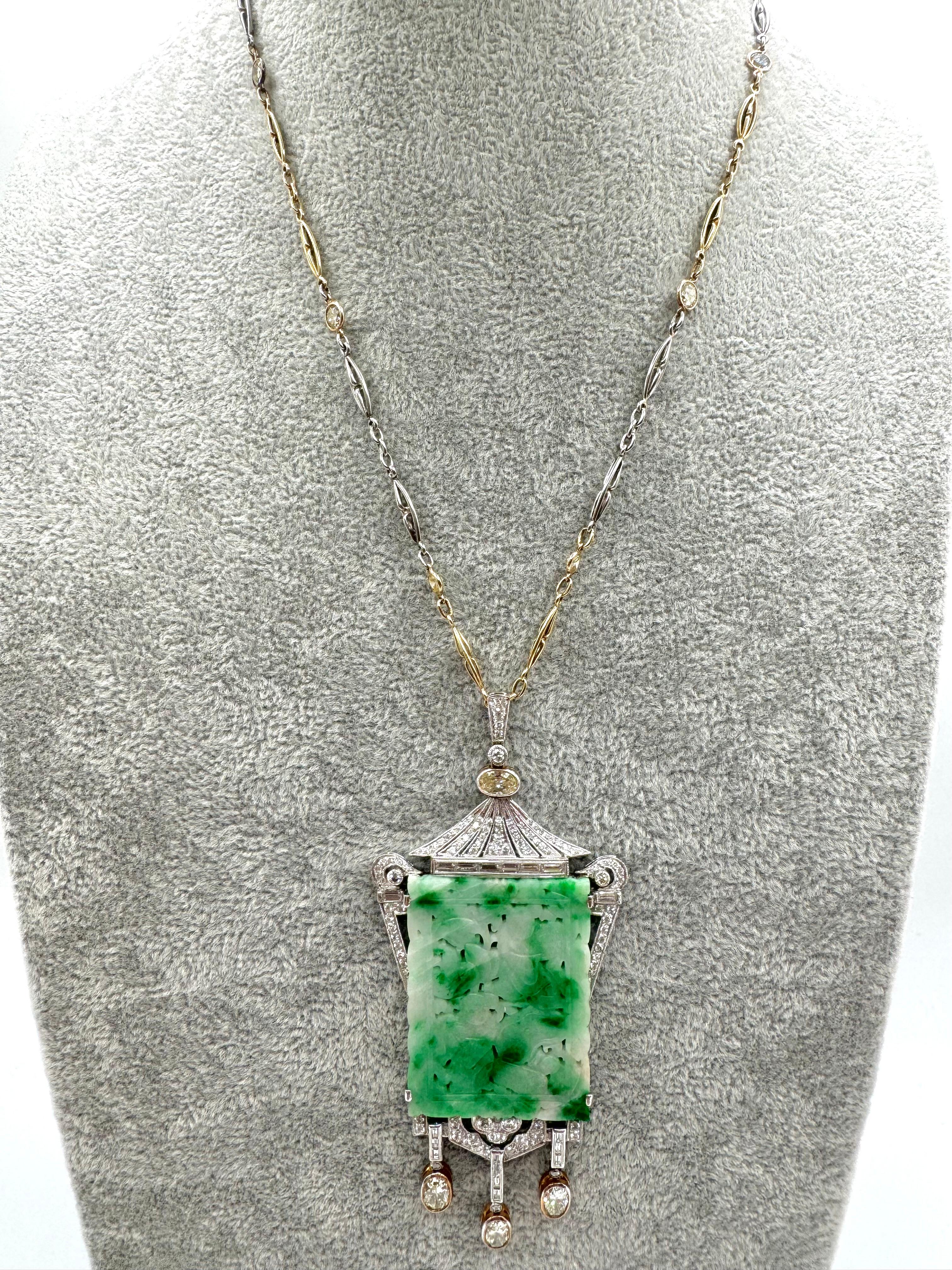 A breathtaking blend of Eastern influence and vintage glamour, this intricately carved jade pendant takes center stage in a dramatic lantern motif, suspended from a detailed two-tone gold chain. Set in 18K white gold, the central jade plaque is