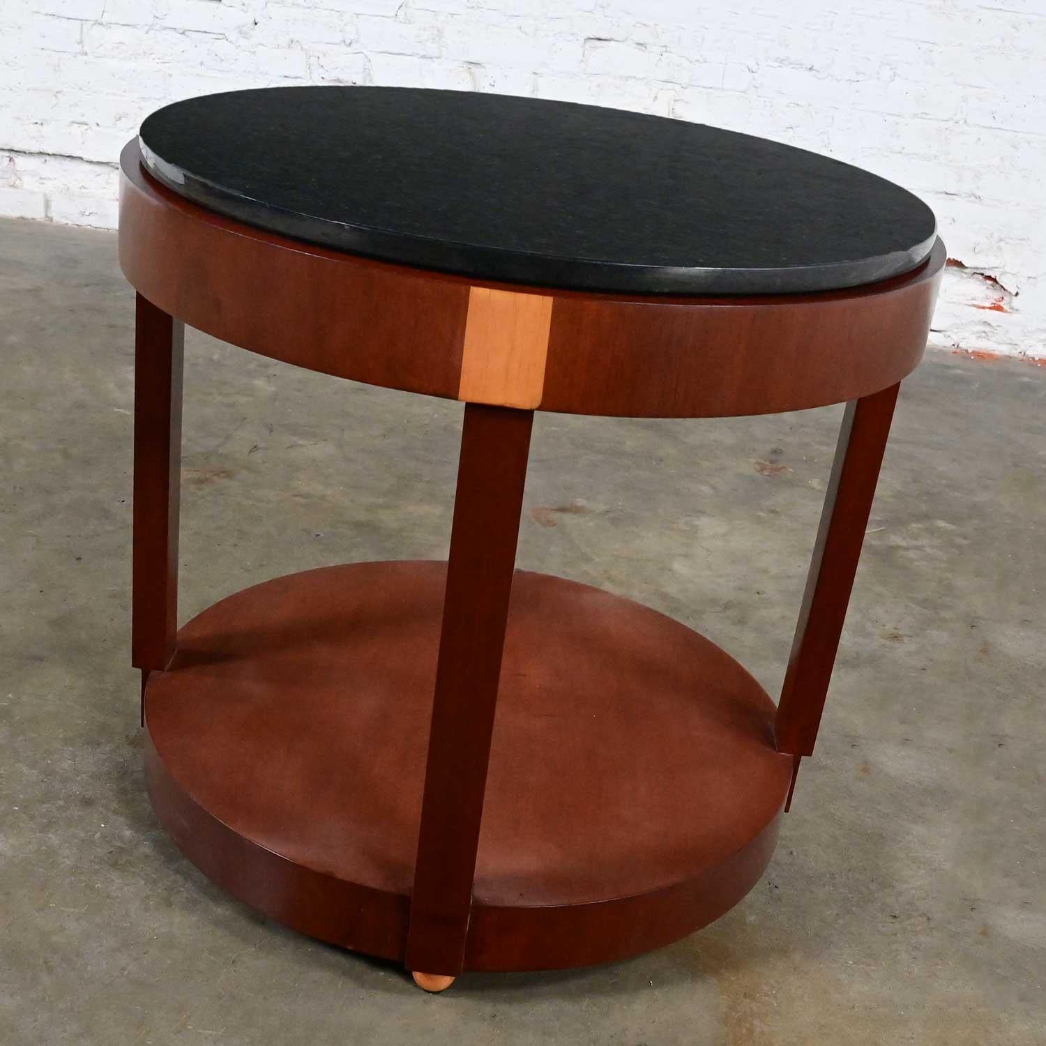 Stunning vintage Art Deco Revival custom two-toned mahogany round side or accent table with a black granite top custom made by Rialto & designed by Zlata Pericic for Meca Design & Production. Beautiful condition, keeping in mind that this is vintage