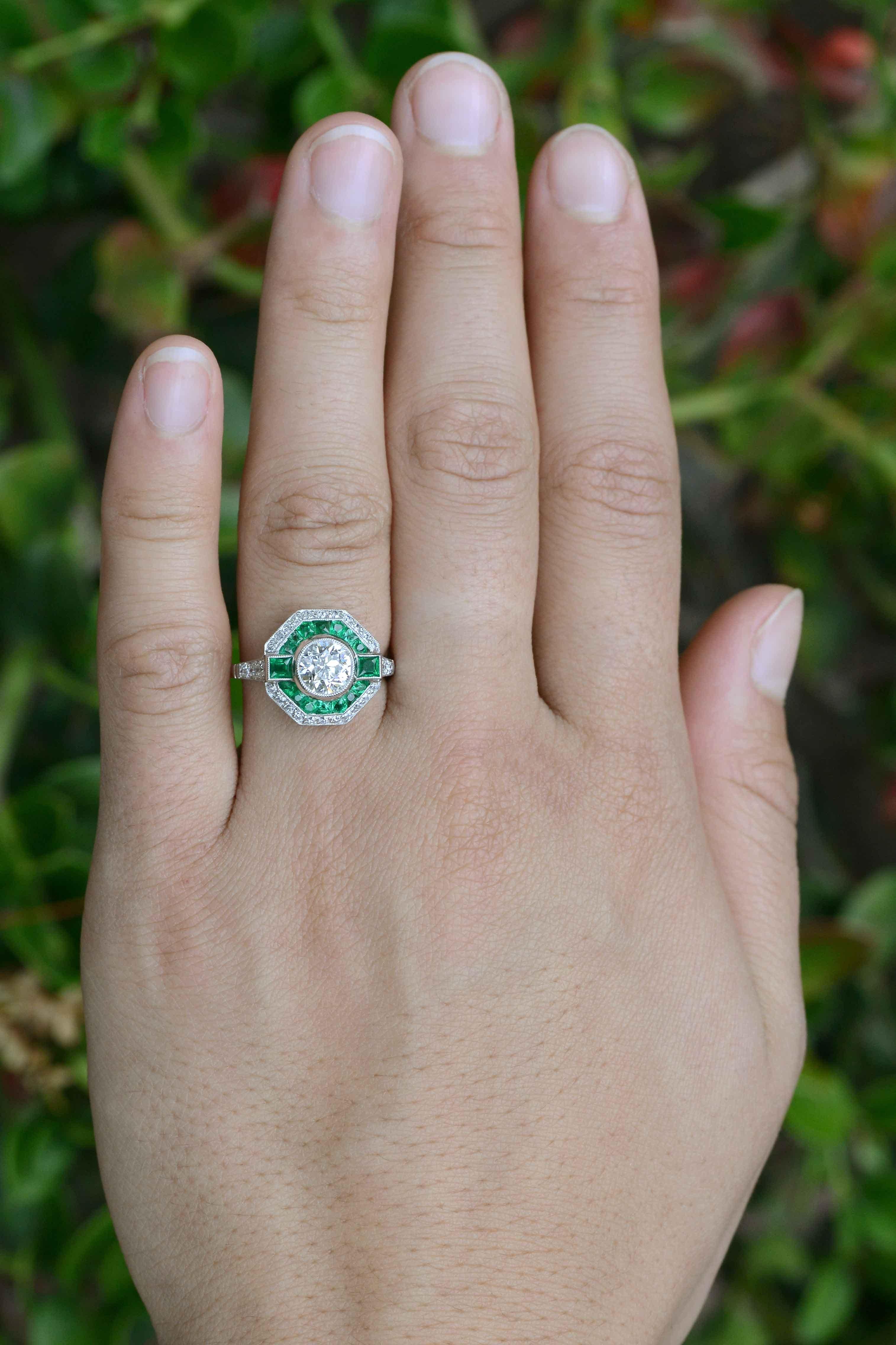 This ring is on hold for a customer.
Please message us if you are interested.

A fabulous example of Art Deco style jewelry, this gorgeous geometric emerald halo diamond engagement ring is a one of a kind treasure that is truly jaw dropping. Hand