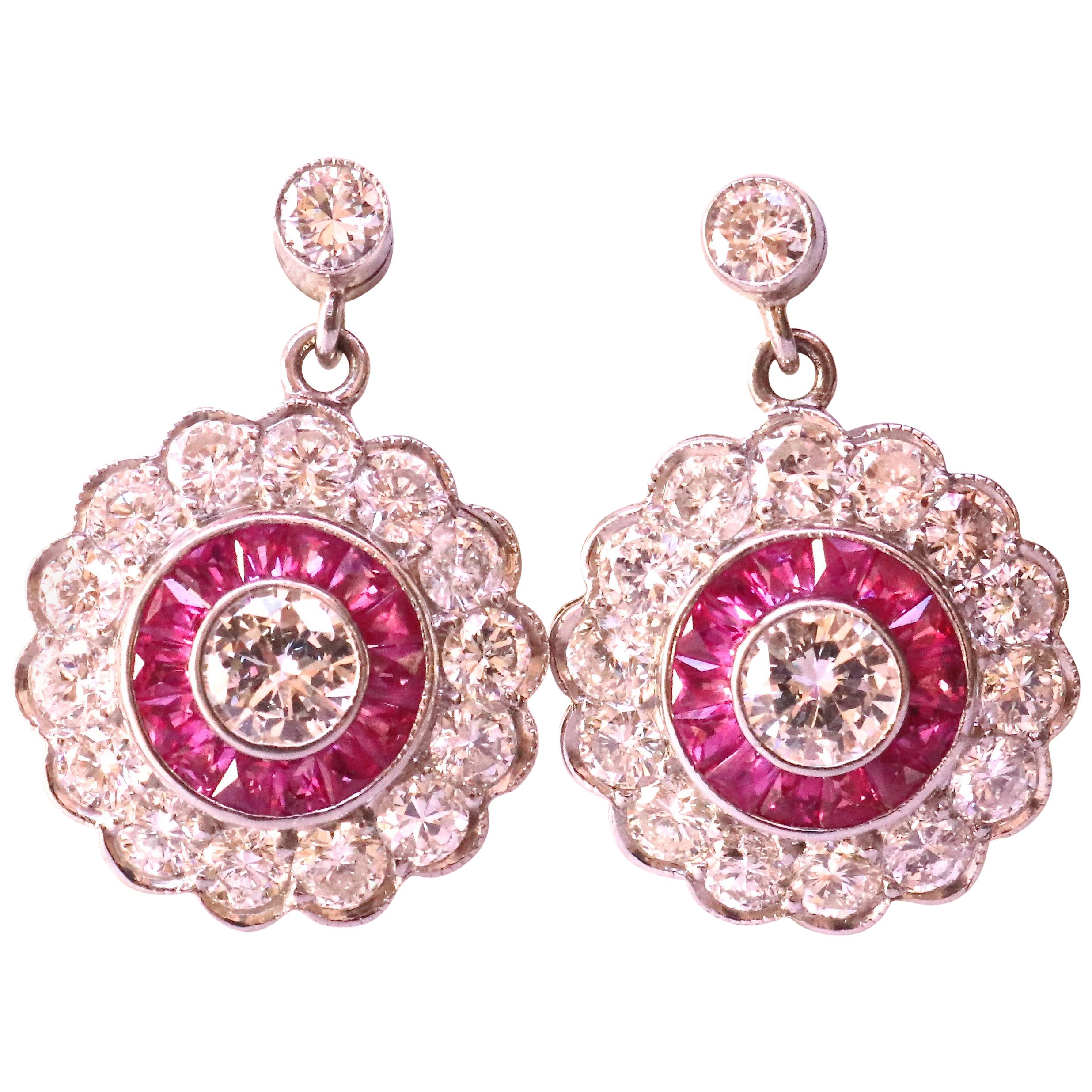 Art Deco style platinum cluster earrings set with 32 modern brilliant cut diamonds that weigh approximately 1.50 carats, graded H-I color, VS-Si clarity. With 28 French cut rubies that weigh approximately 0.50 carats. Circa 2019.

Our 1stdibs