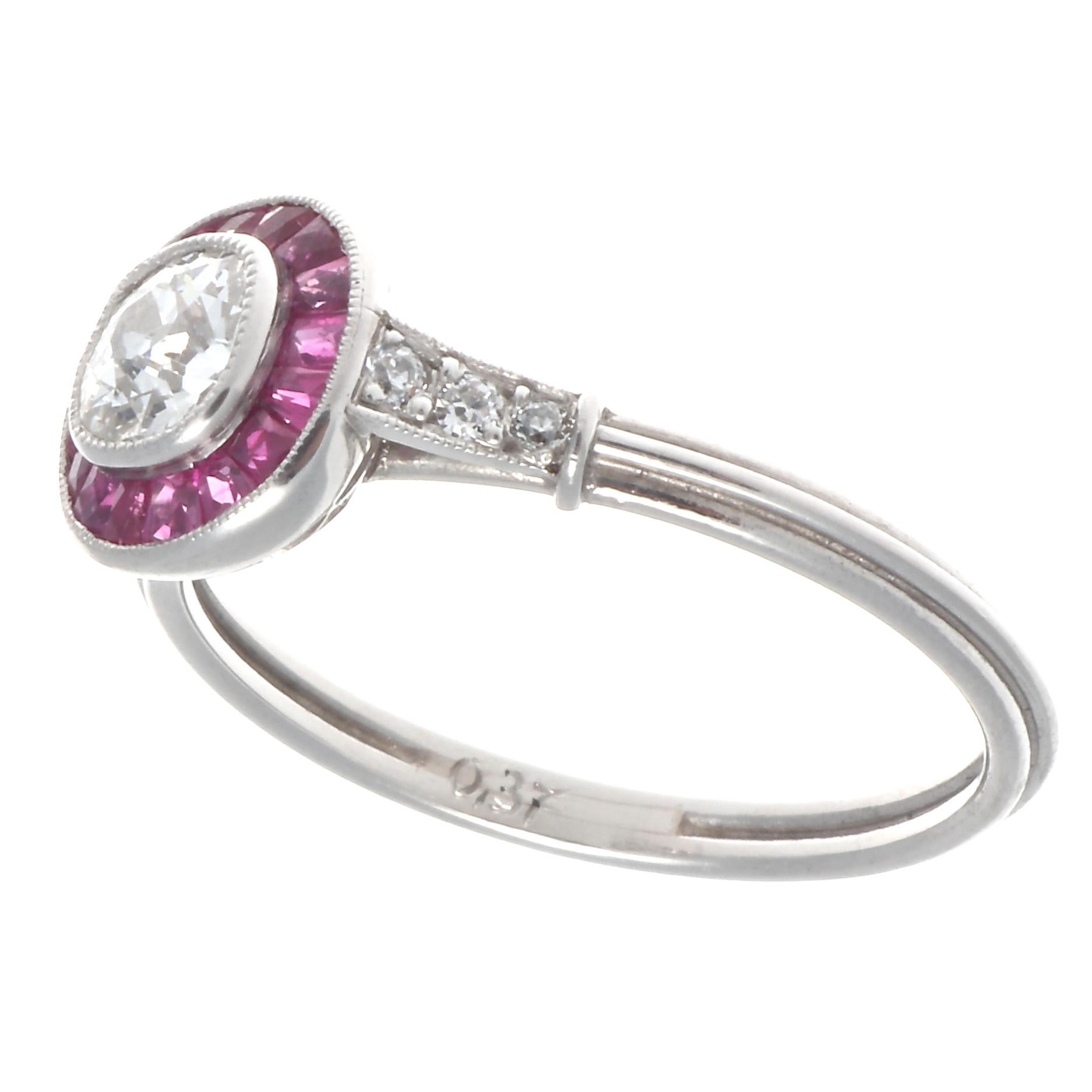 Art deco inspired 0.37 carat old European cut diamond, graded G-H color, VS clarity. With 16 French cut rubies that weigh approximately 0.50 carats, and 6 old European cut diamonds graded H-I color, SI clarity. Crafted in platinum. Size 6 1/2 and