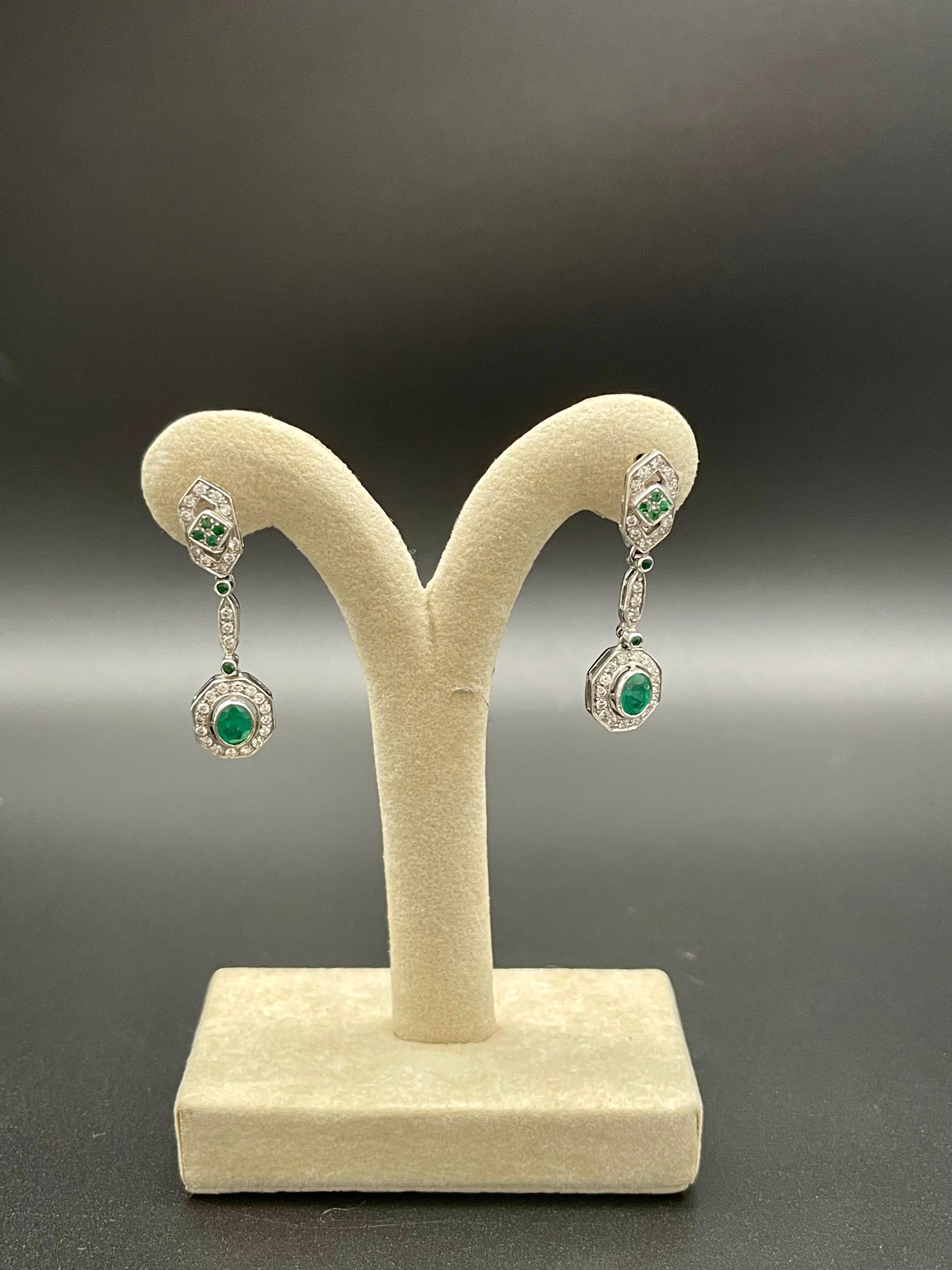 A Breathtaking pair of Portuguese Earrings in Art Deco Revival Style with a stunning work of craftsmanship.  

This wonderful 19.2 Karat Portuguese White gold earrings beautifully blend color, sparkle, and sweeping, graceful curves. These glamorous