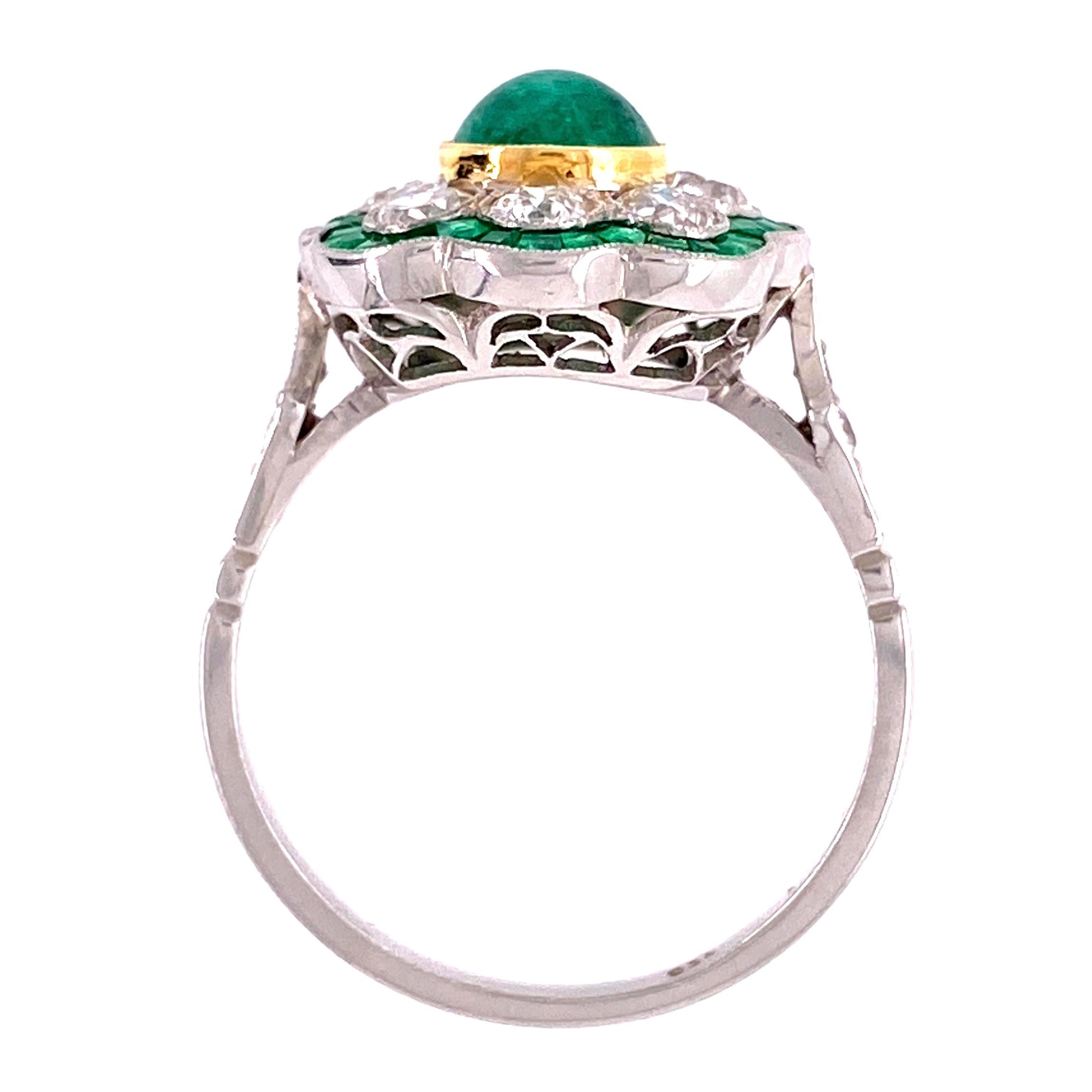 Beautiful, Elegant and finely detailed Art Deco Revival Platinum Ring, center securely nestled with a Green Emerald, surrounded by Diamonds and small Diamonds enhancing the shank and French-cut Emeralds. Approx. total weight of Emeralds 1.69 Carat;