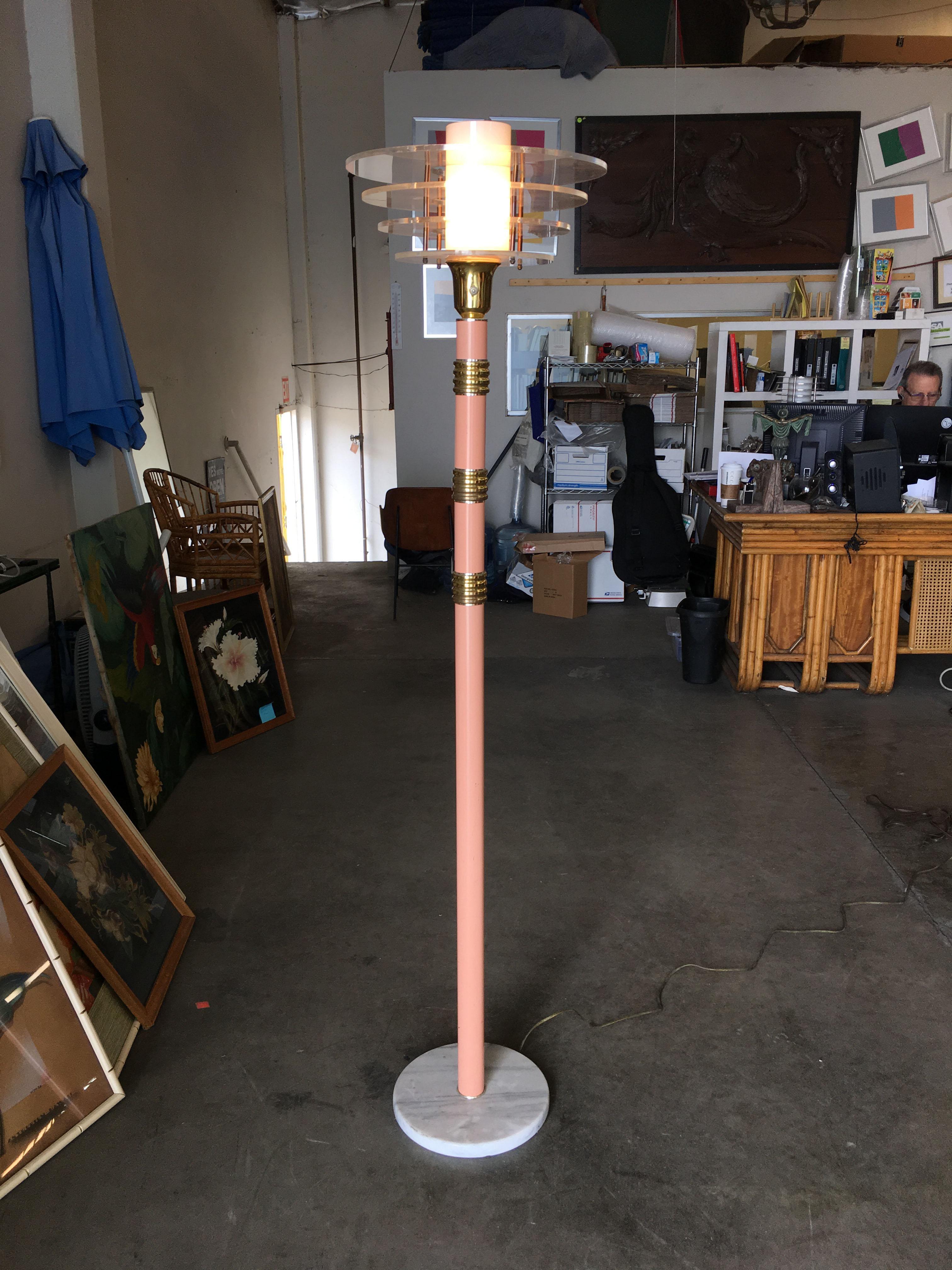 Memphis style floor lamp features brass and pink enameled base with an acrylic and glass machine-age inspired shade. Great for that Vapor Wave Miami Vice living room!

Circa 1980.
Dimensions: 66