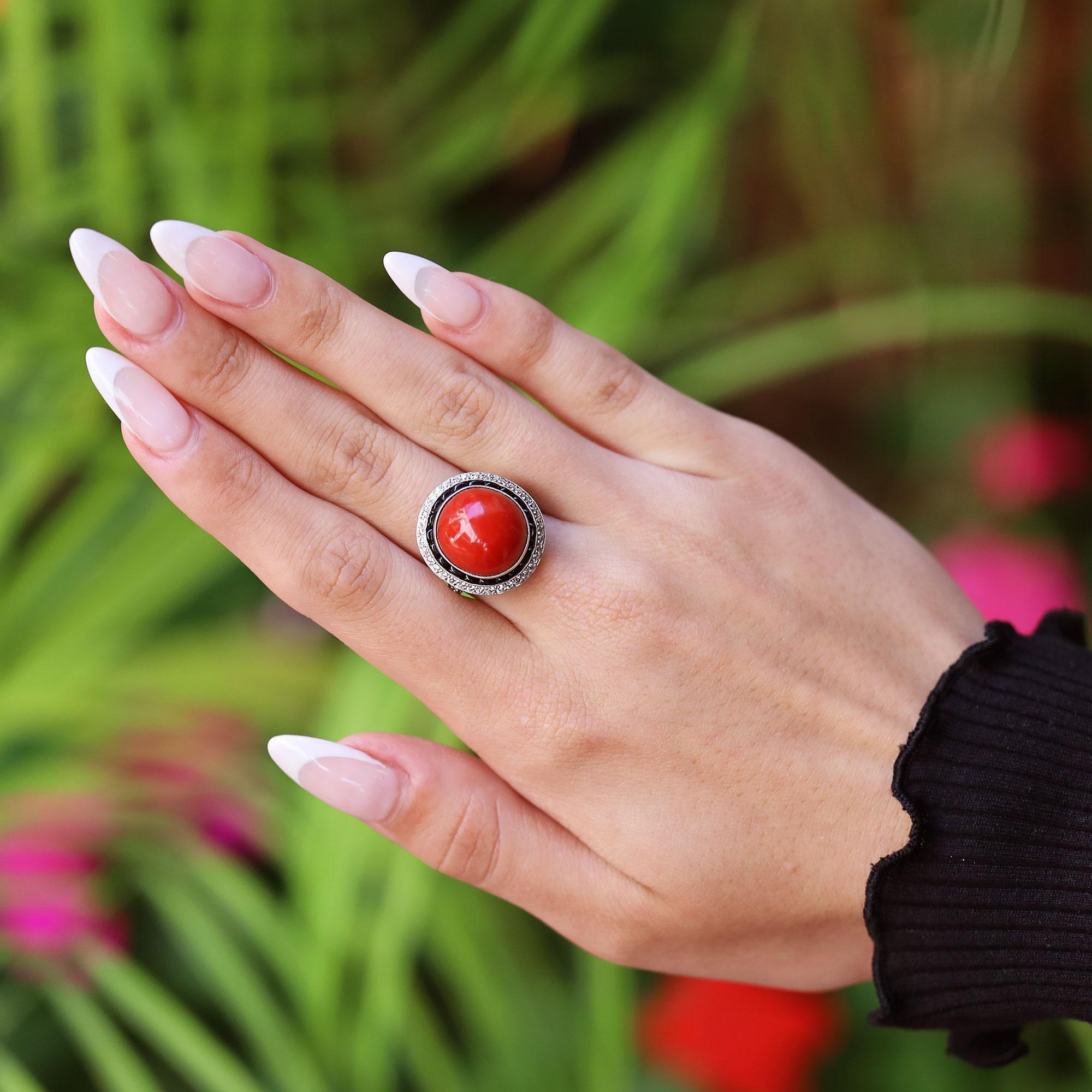A roaring 20's Art Deco style coral cocktail ring like no other. Just like a Jazz Age flapper with a drink in hand, this is not for the faint of heart, with a large, lustrous ox blood red coral cabochon creating a stunning contrast with black onyx