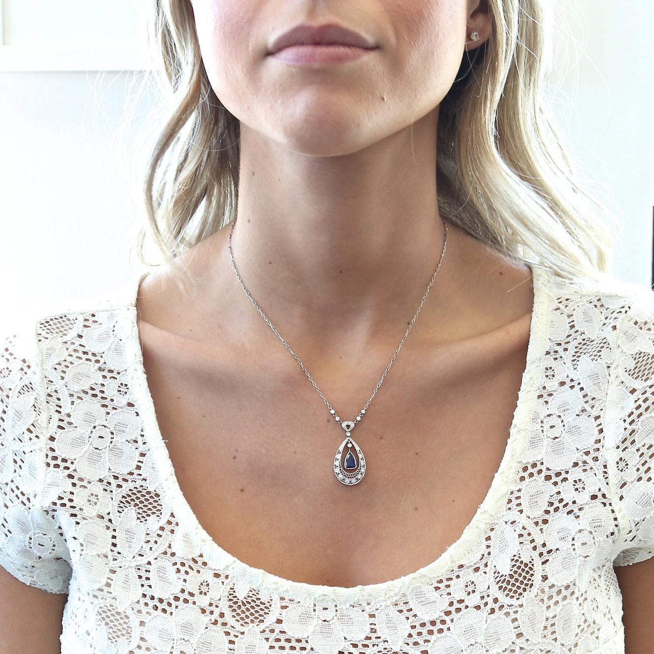 Sophisticated elegance through rudimentary design. Featuring a floating sapphire surrounded by an orbit of diamonds and platinum. Elegantly strung by a delicately crafted platinum chain. 