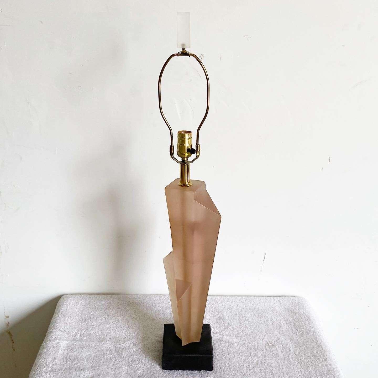 Exceptional 1980s art deco revival sculpted table lamp by Paolo Gucci. Features a pink resin body on a back square base.
