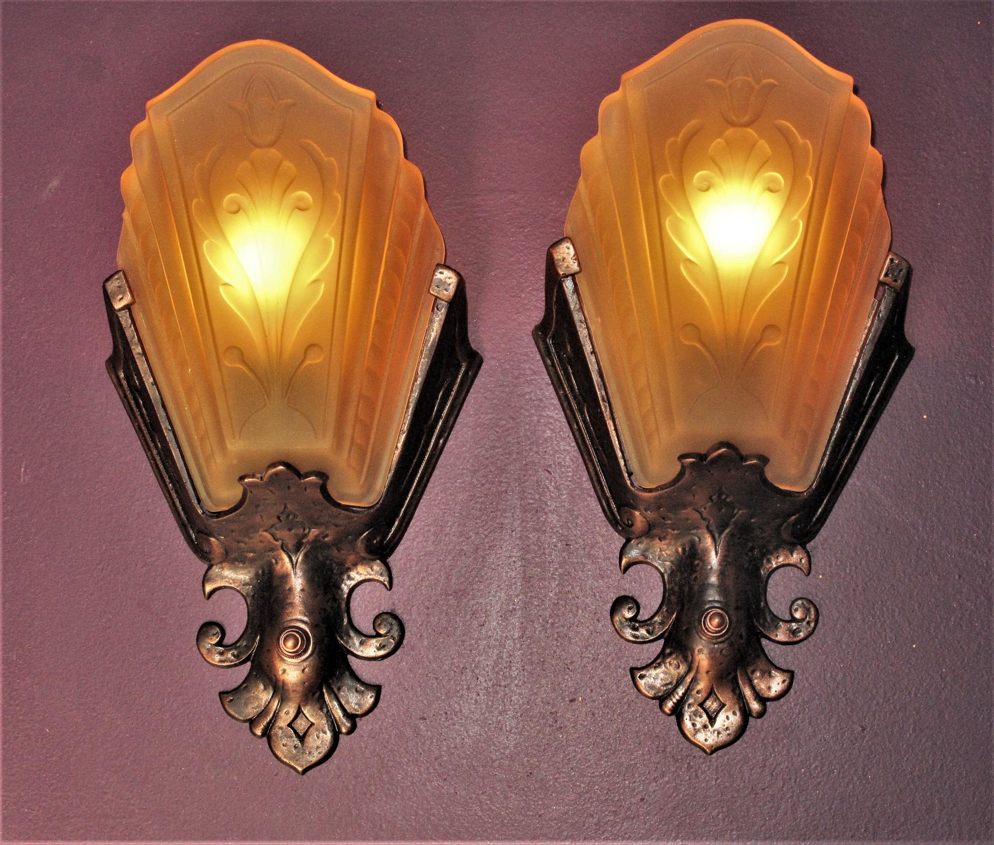 Priced per pair with two pair available.
A great pair of vintage wall sconces from the early 30s. What makes these antique sconces so unique is the design elementation. Although they have some art deco influence, they were designed with a nod