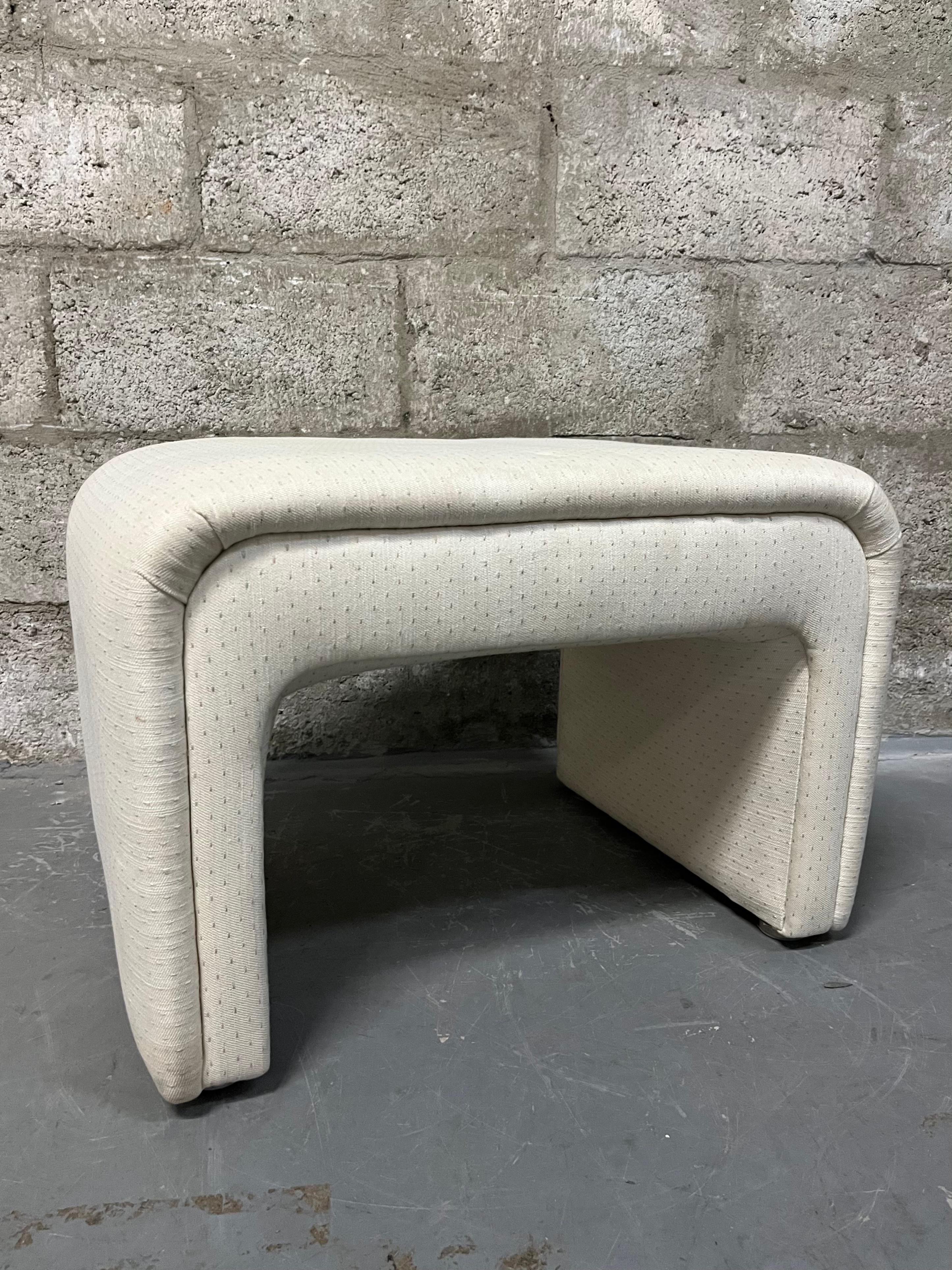 Vintage Postmodern / Art Deco Revival Upholstered Waterfall Bench by Thayer Coggin. Circa 1980s
Features the original cream color upholstery with soft pastel pinks and teals tones alternate stitching.
In good original cosmetic and sound condition