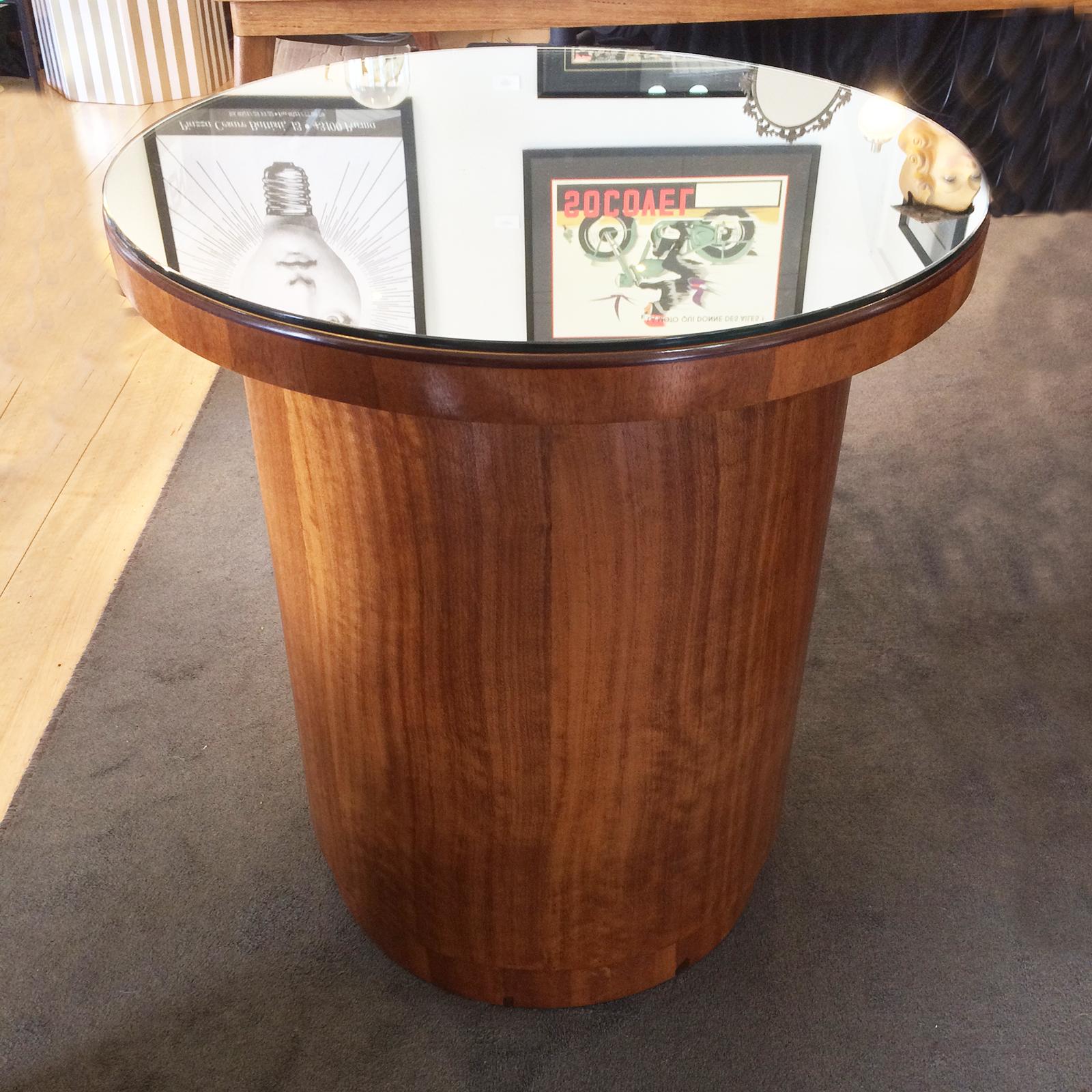 Art Deco revolving bar or whisky cabinet has a mirrored top for use as coffee table or wine table. The inner section with green Felt rotates within itself and has 4 different sections each with different height glass shelves for bottles and glasses.