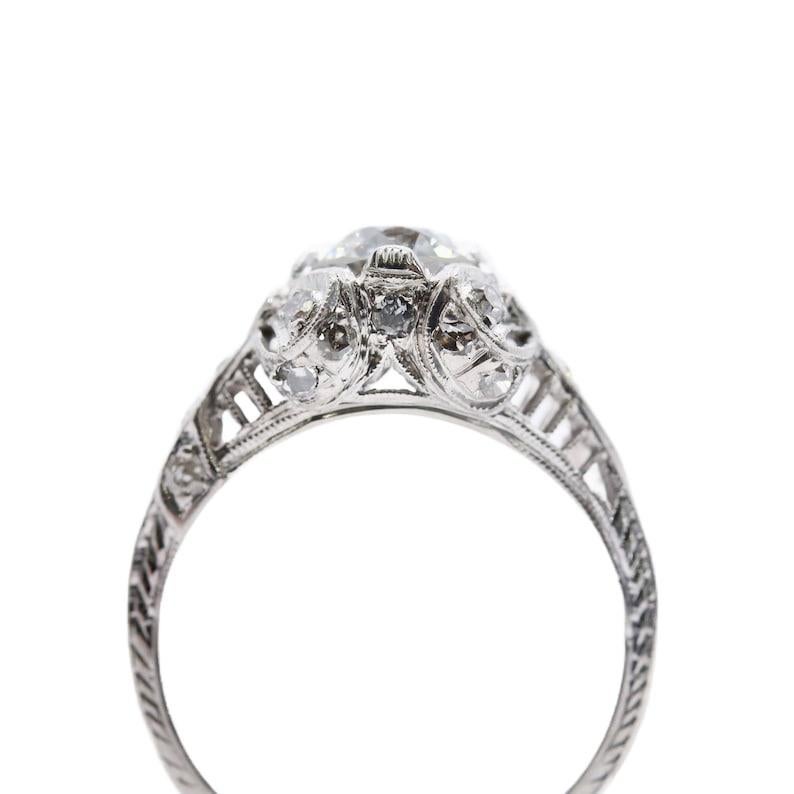 Art Deco Ribbon Motif 1.24ctw Diamond Engagement Ring in Platinum Circa 1920's In Good Condition For Sale In Boston, MA