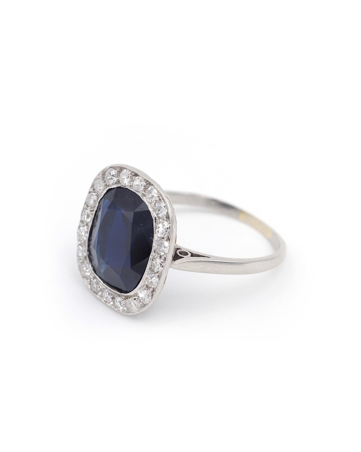 Art Deco sapphire and diamond ring in platinum, it is centered with a large cushion-cut intense blue sapphire, weighing 5.13 carats. The sapphire is surrounded by 20 8/8-cut diamonds. Art Deco ring, circa 1930, France.

Dog head hallmark and