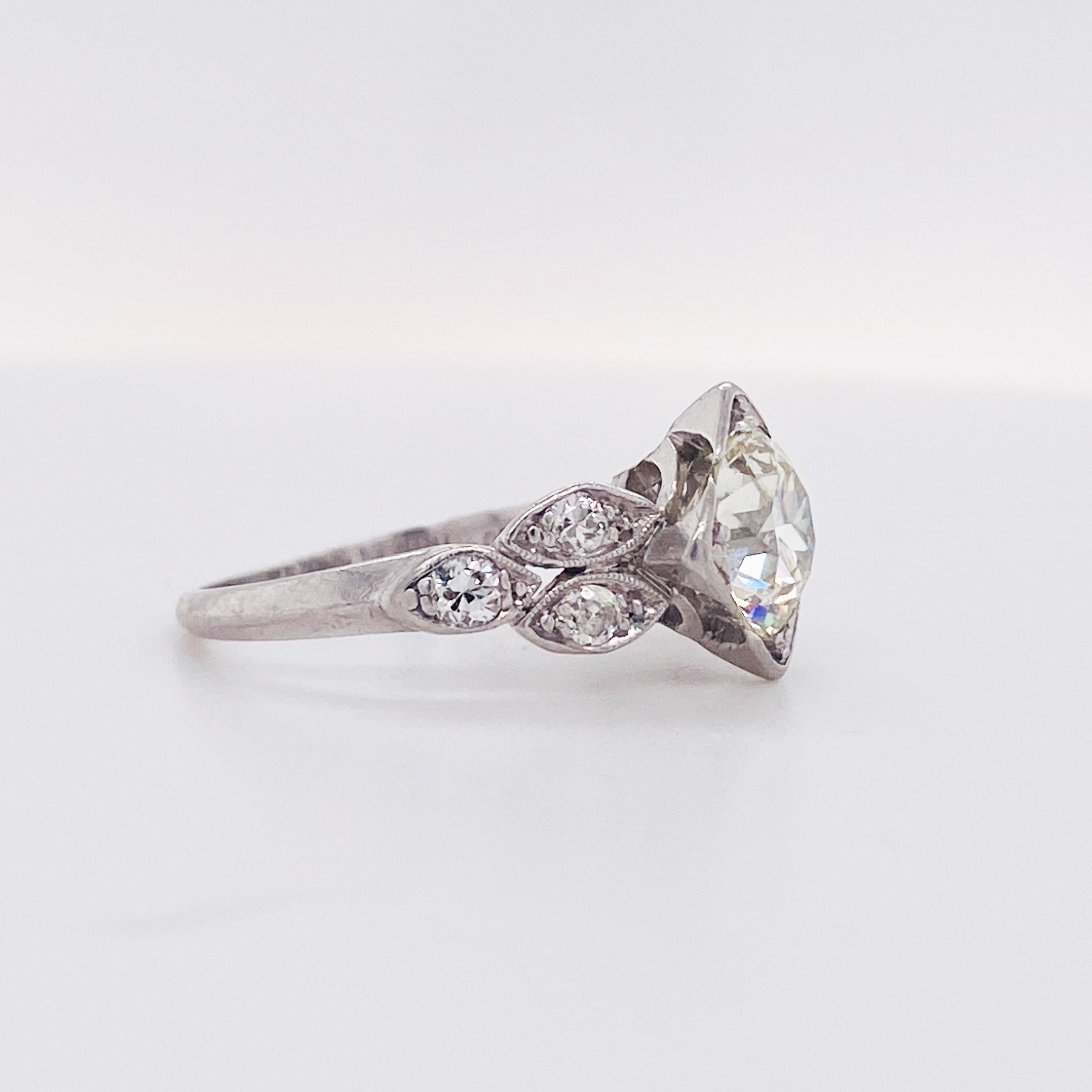This Art Deco engagement ring is to die for!  Totally unique with a 1.50 carat Old European cut natural diamond.  The diamond is in its original setting from Circa 1930. The strong platinum setting is holding the diamonds very securely and for being
