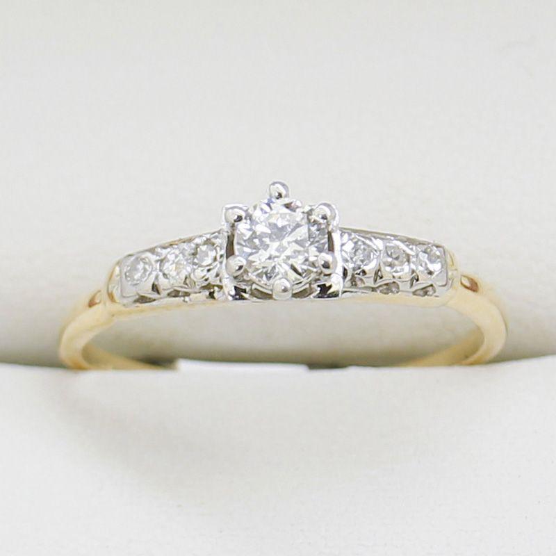 A 14ct Yellow gold & Platinum two-tone handmade Art Deco diamond engagement ring featuring a European cut diamond platinum in a 6 claw setting with three single cut diamonds Platinum on both sides of a 1.90 - 0.70mm wide yellow gold shank. Stamped