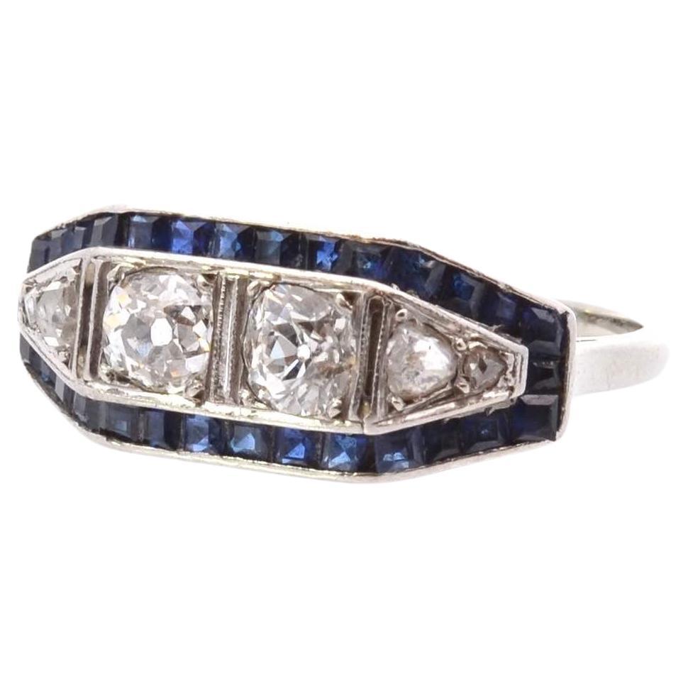 Art déco ring with diamonds and calibrated sapphires For Sale