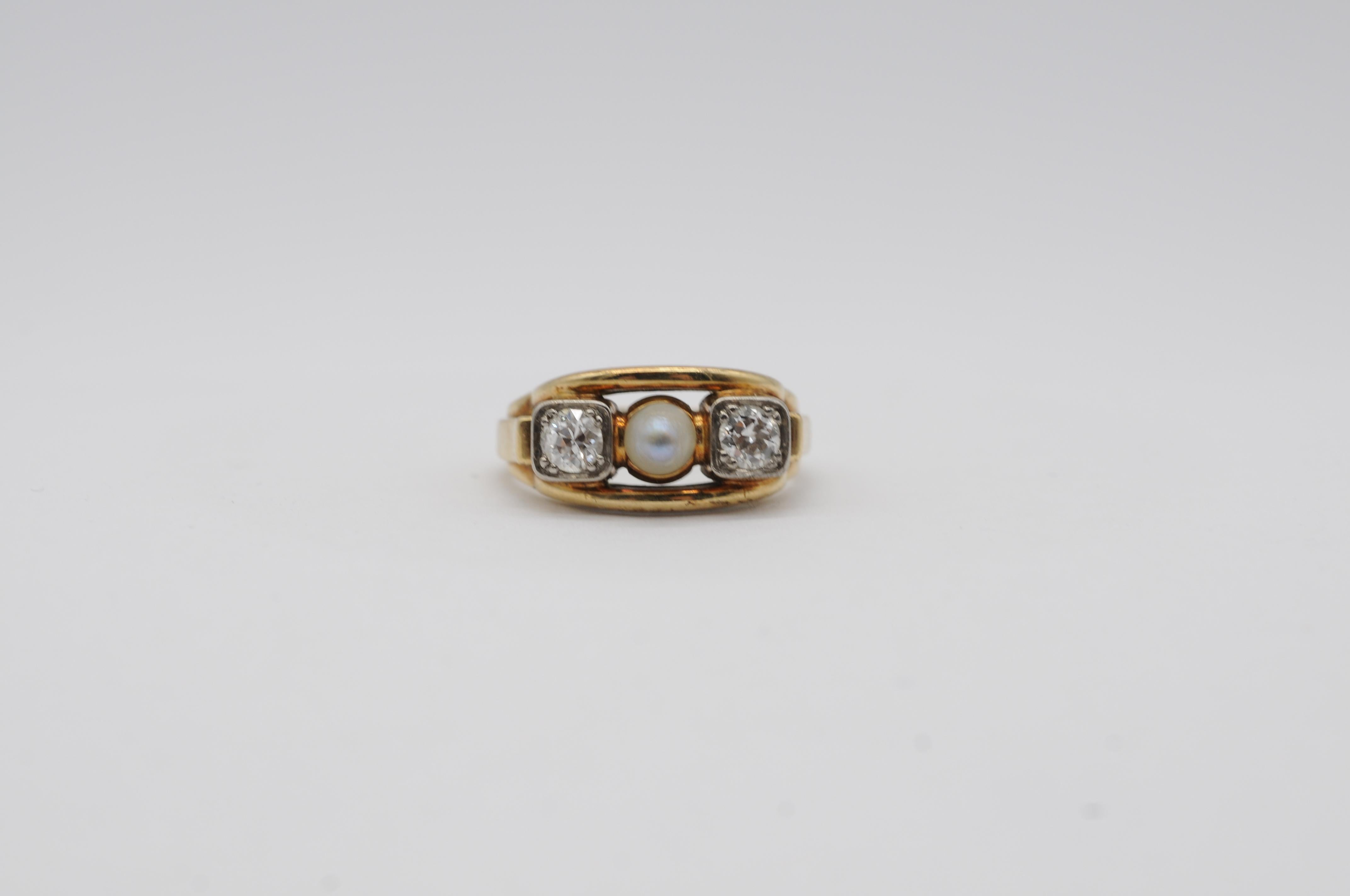 This exquisite 14k Art Deco ring, crafted in classic yellow gold, features a timeless three-stone design. At its center lies a lustrous Akoya cultured pearl, radiating a soft, natural glow that embodies elegance. Framing the pearl on each side are